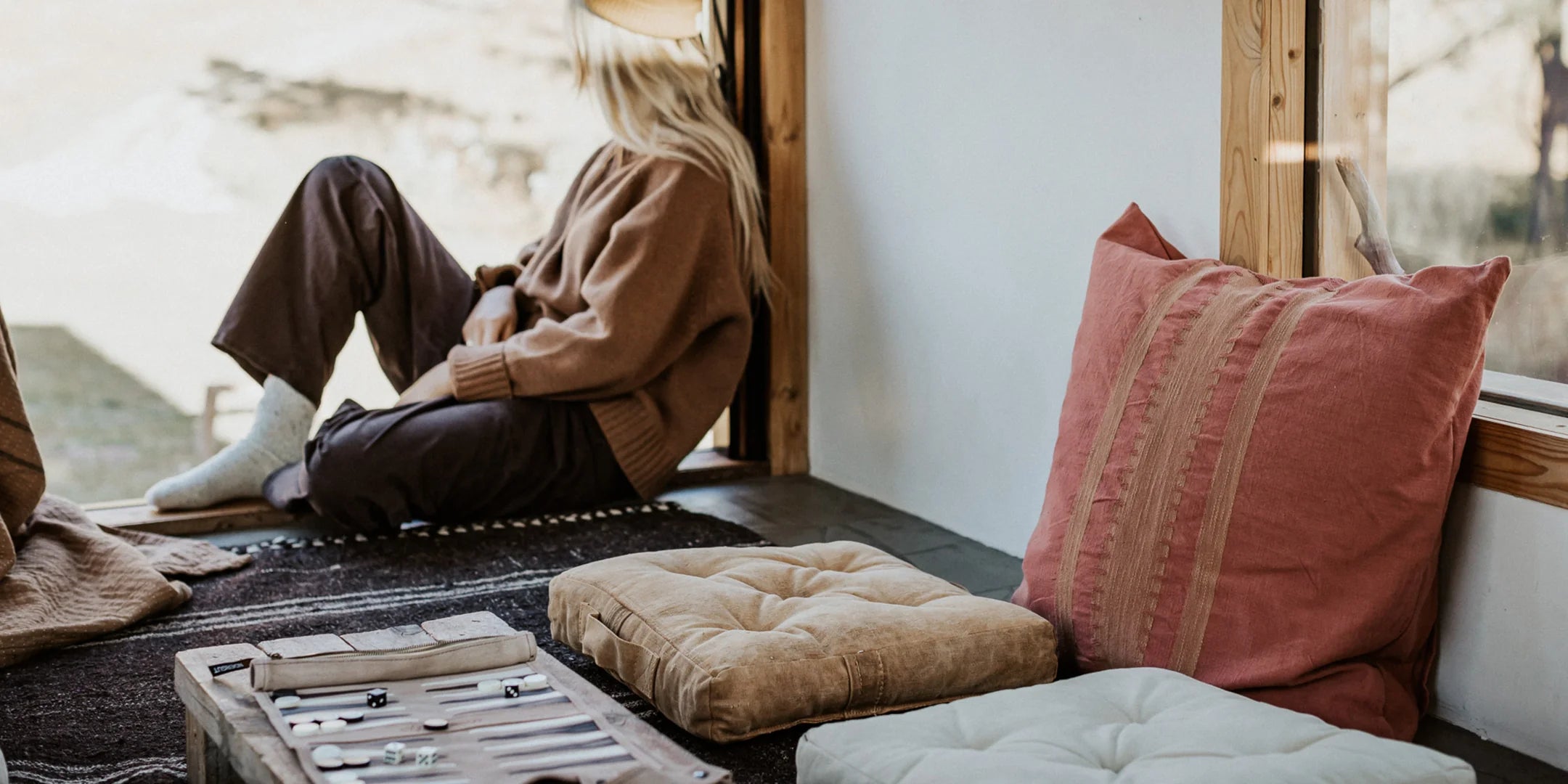 Pony Rider cushions shown in rustic home with model