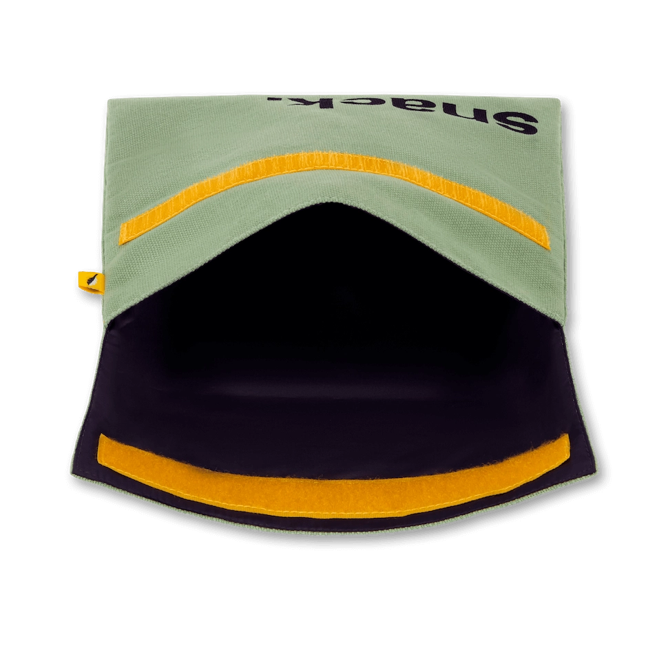 Flip Reusable Snack Bag shown in Moss laying on side open from top