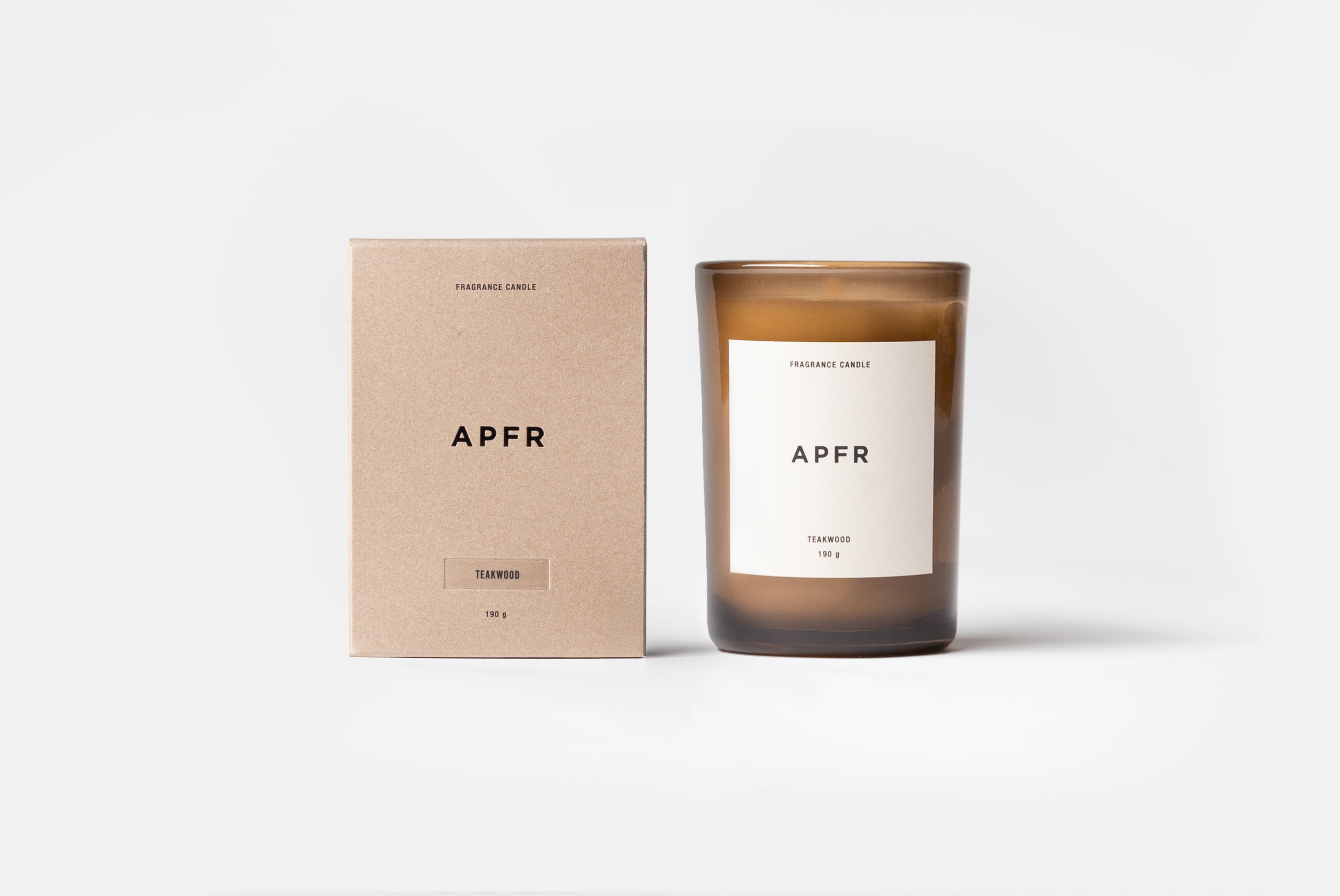 APFR Fragrance Candle in Teakwood scent, shown with box on white background