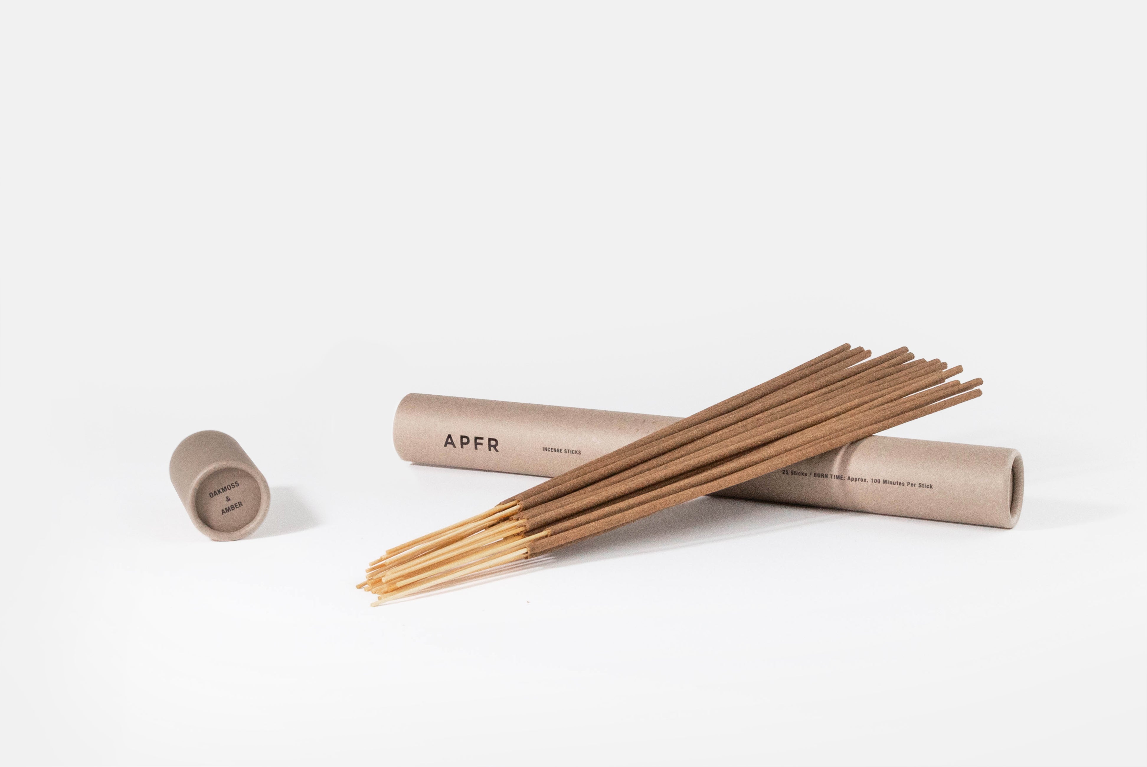 APFR Incense Sticks from Japan, shown with cylinder package in Oakmoss & Amber scent on white background