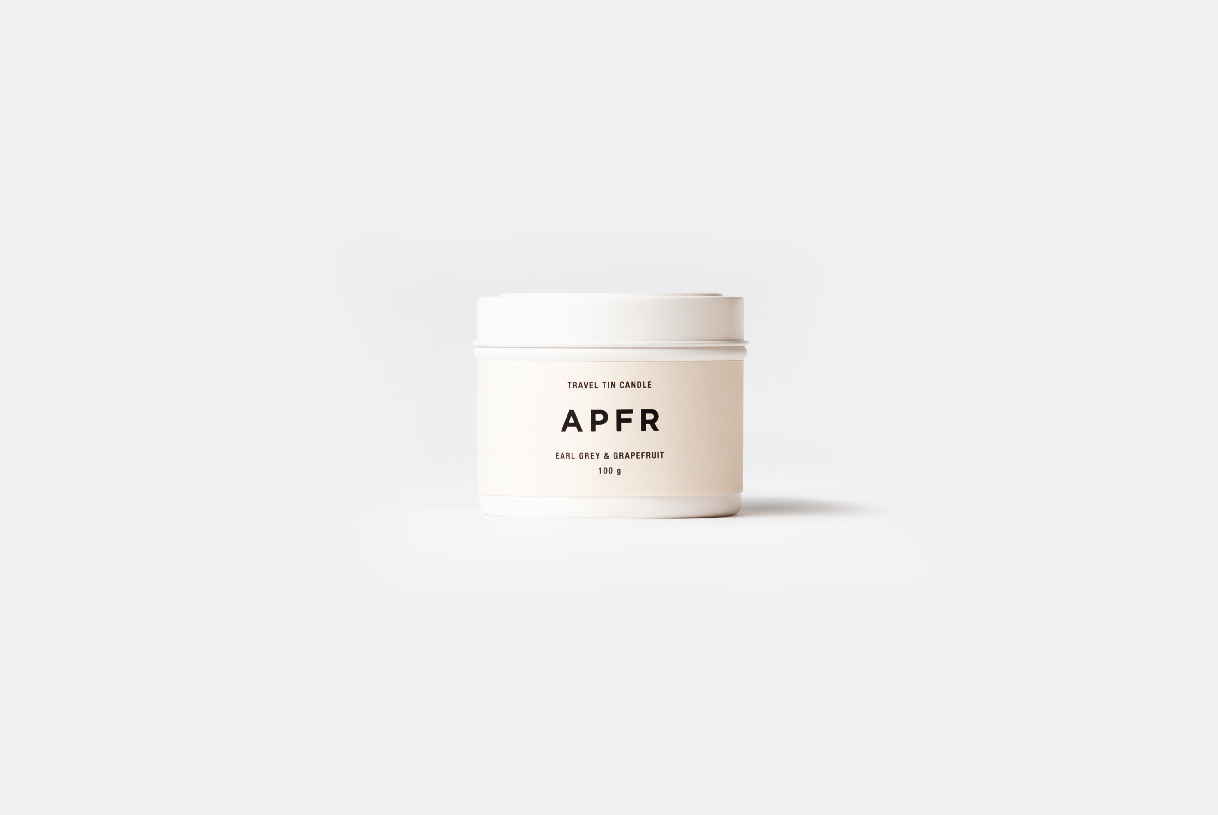 APFR Travel Tin Candle in Earl Grey+Grapefruit scent, shown on white background