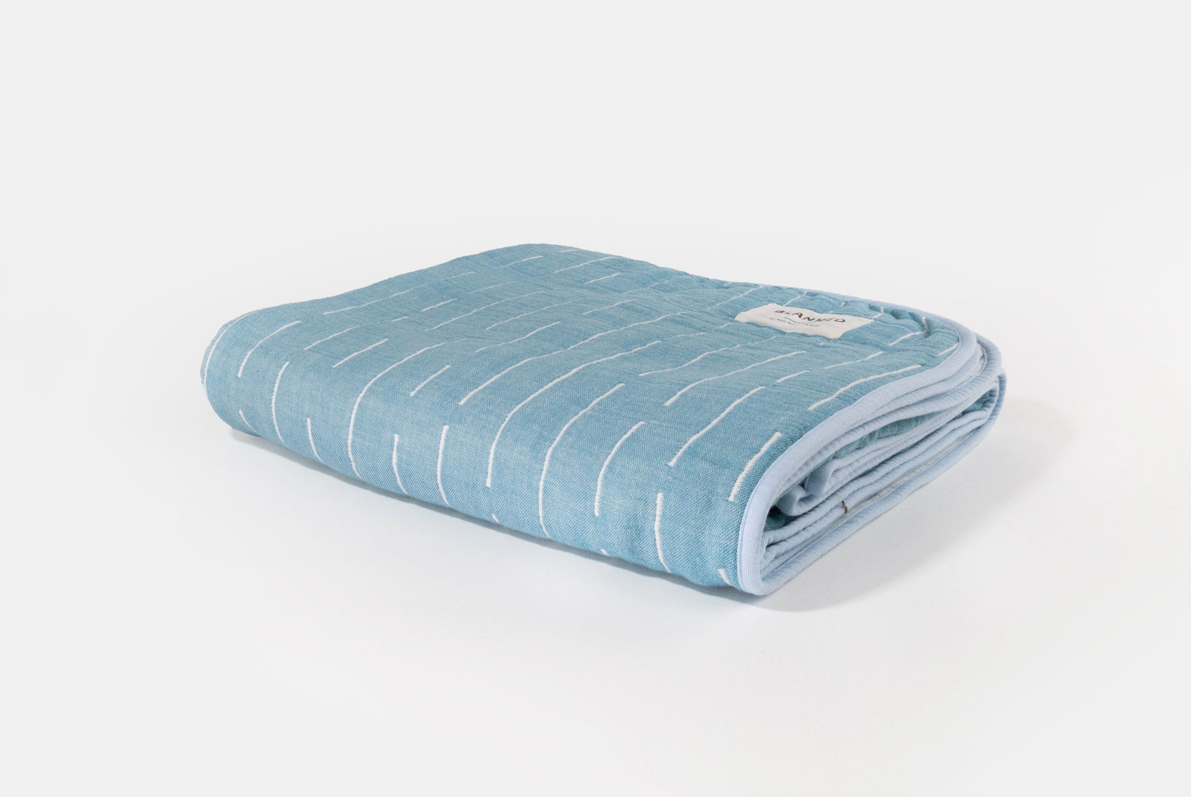 Japanese Cotton Blanket by Blanked, shown in Shitoshito (blue & white), on white background