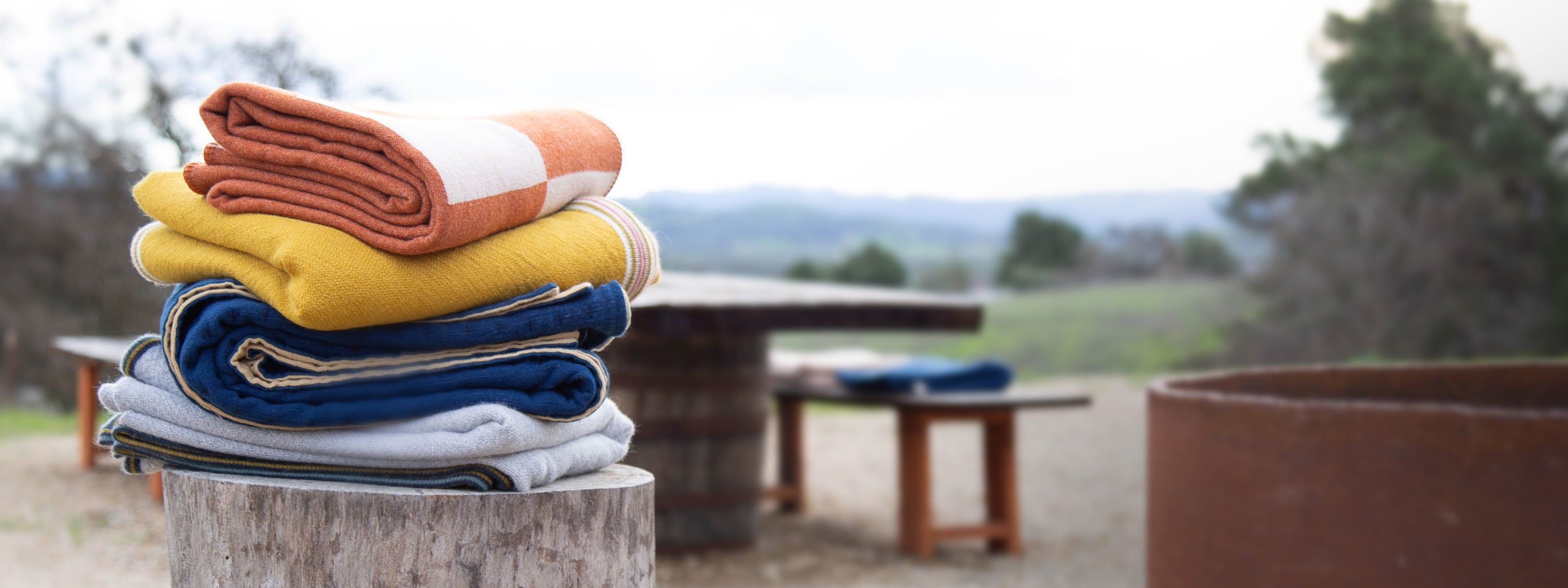 Blankets stacked on a stump at Campover Ranch in Paso Robles, CA