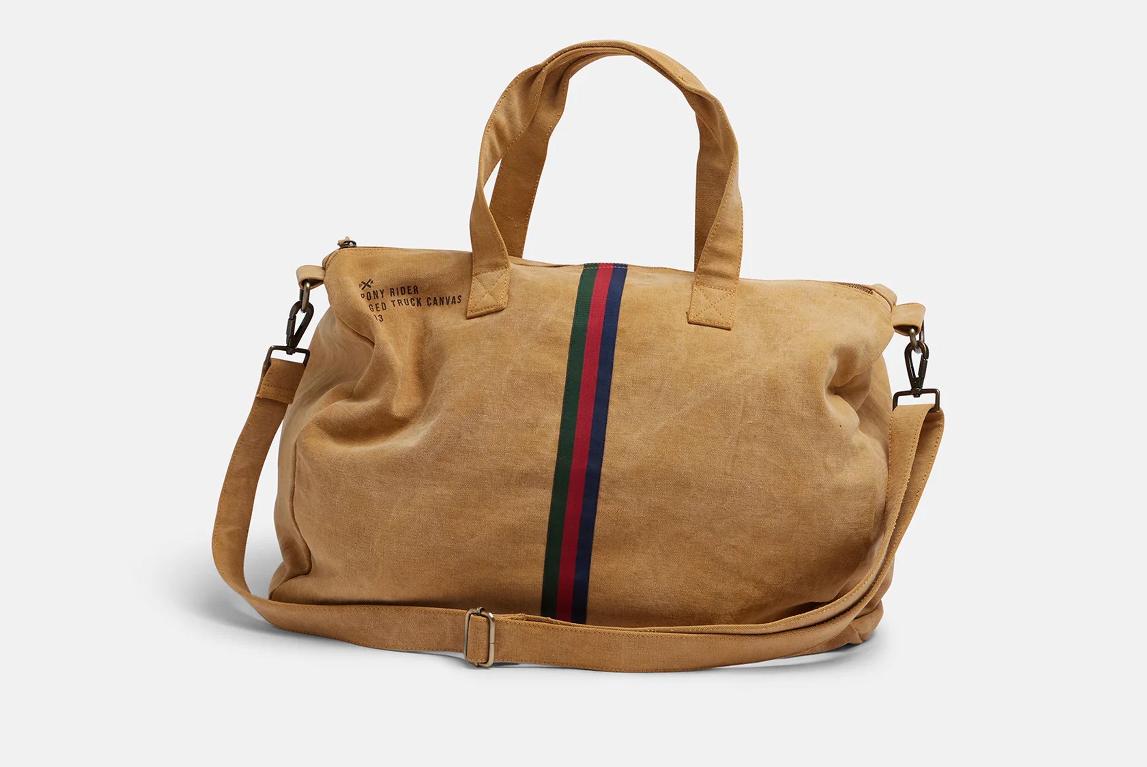 Escapee Overnight Bag by Pony Rider shown on white background shown from front angle with shoulder strap showing