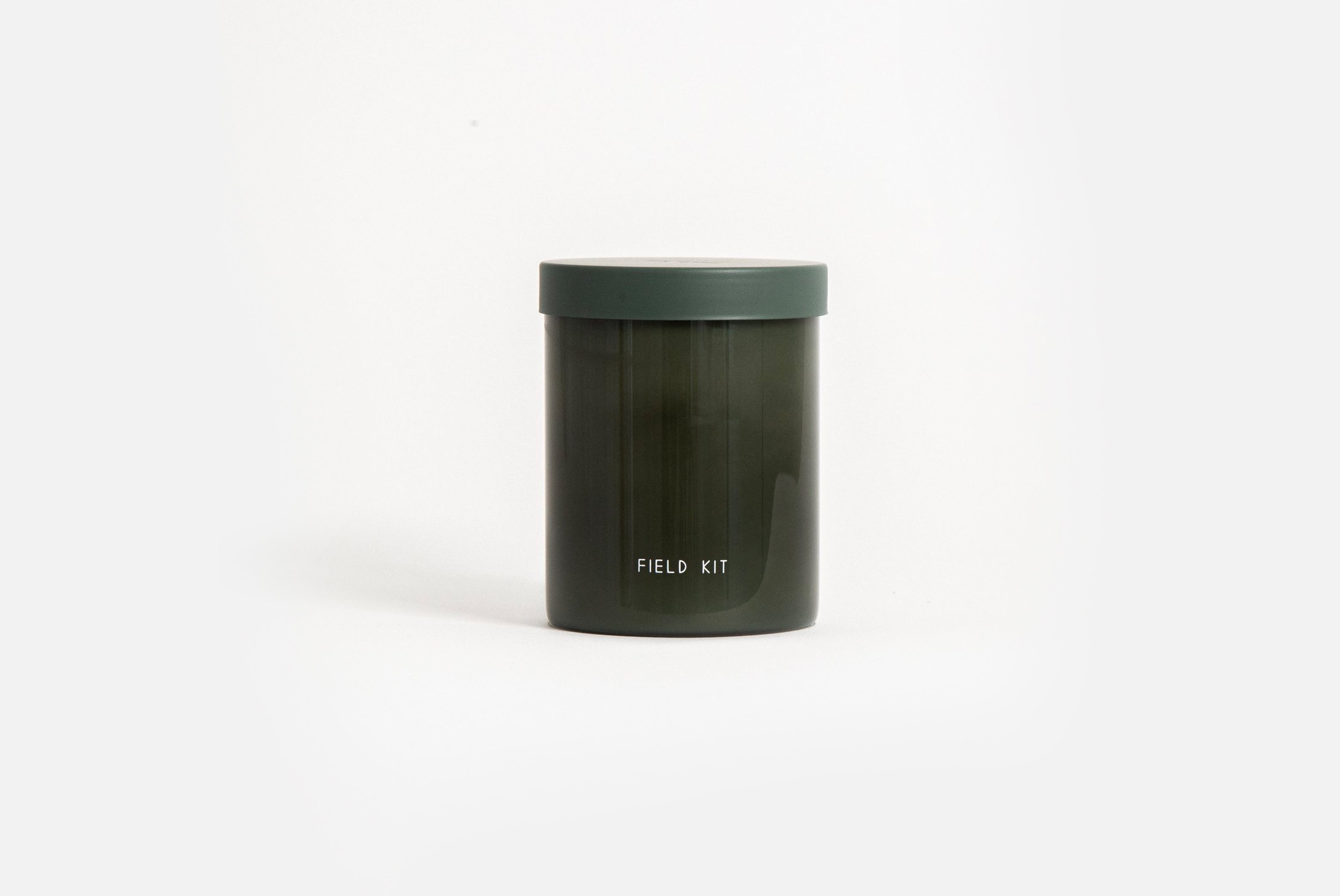 Field Kit The Greenhouse Candle in tomato leaf scent shown on white background