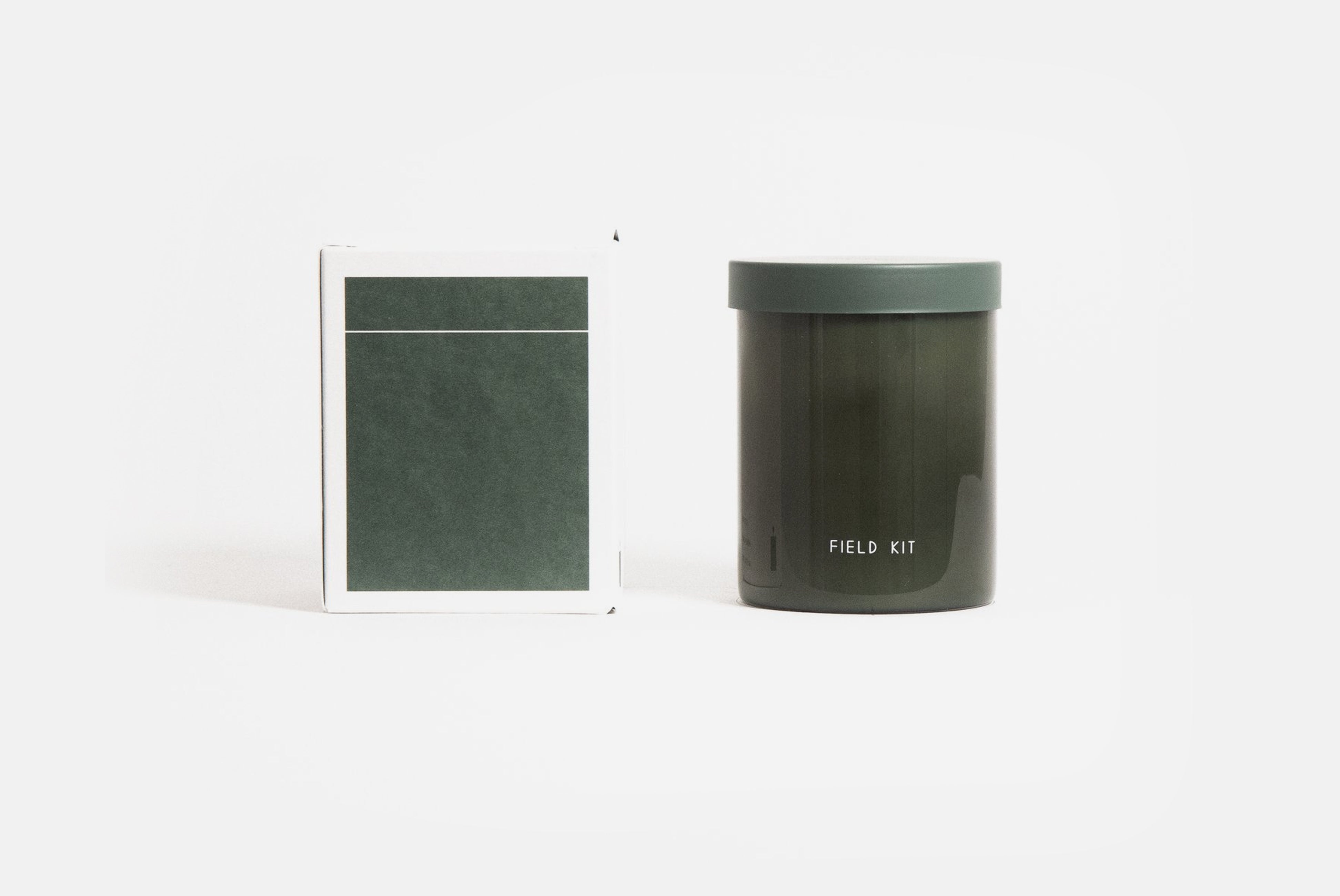Field Kit Explorer Candle in bergamot + ginger scent shown with box backside on white background