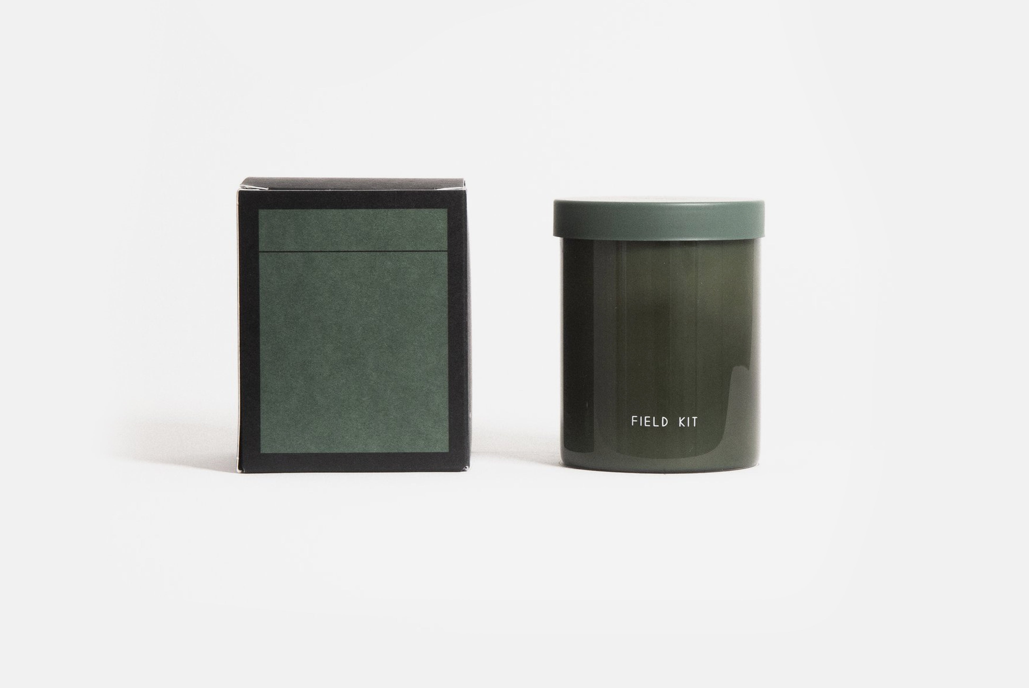 Field Kit The Greenhouse Candle in tomato leaf scent shown with back of box on white background
