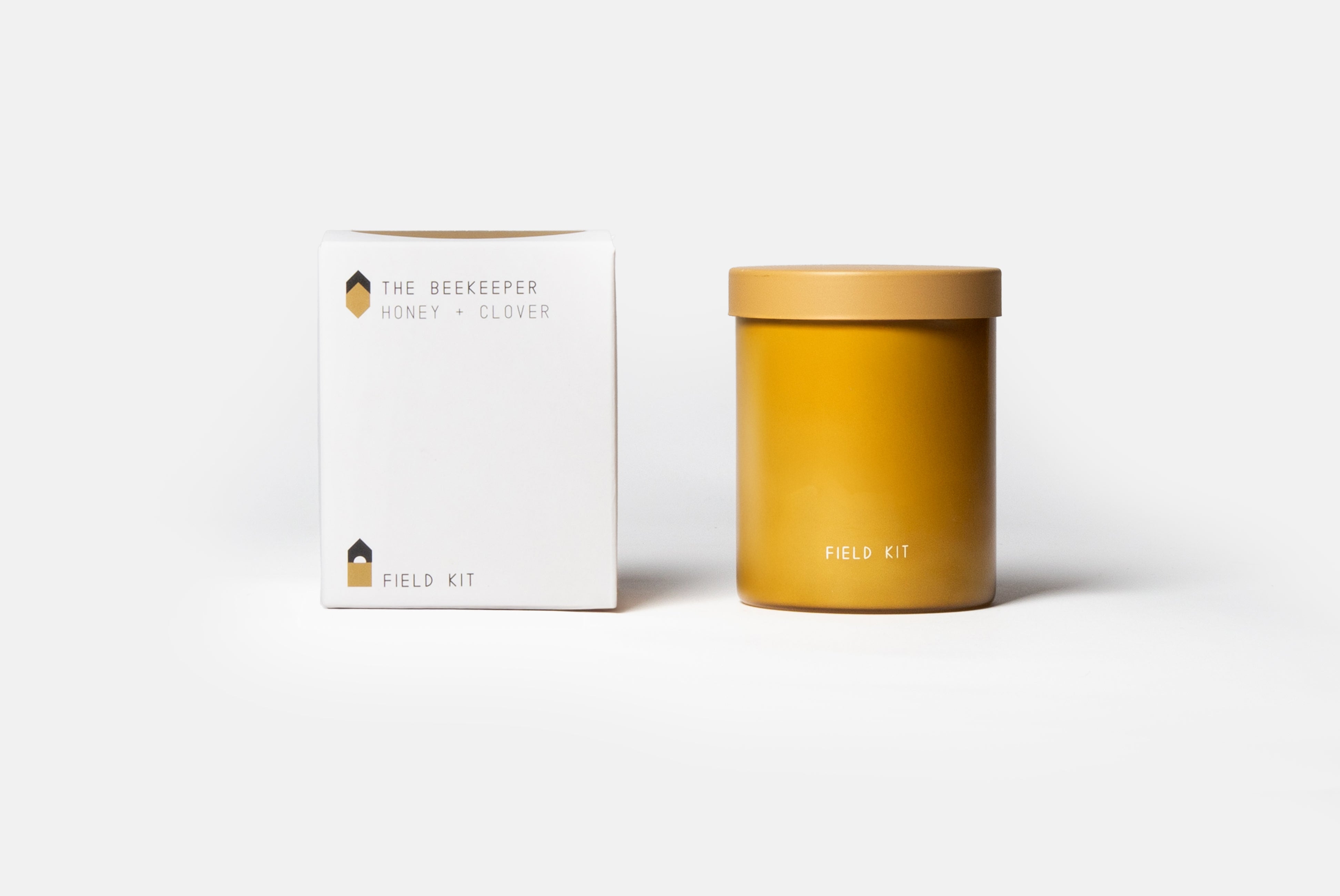 The Beekeeper Candle by Field Kit, shown with box on white background