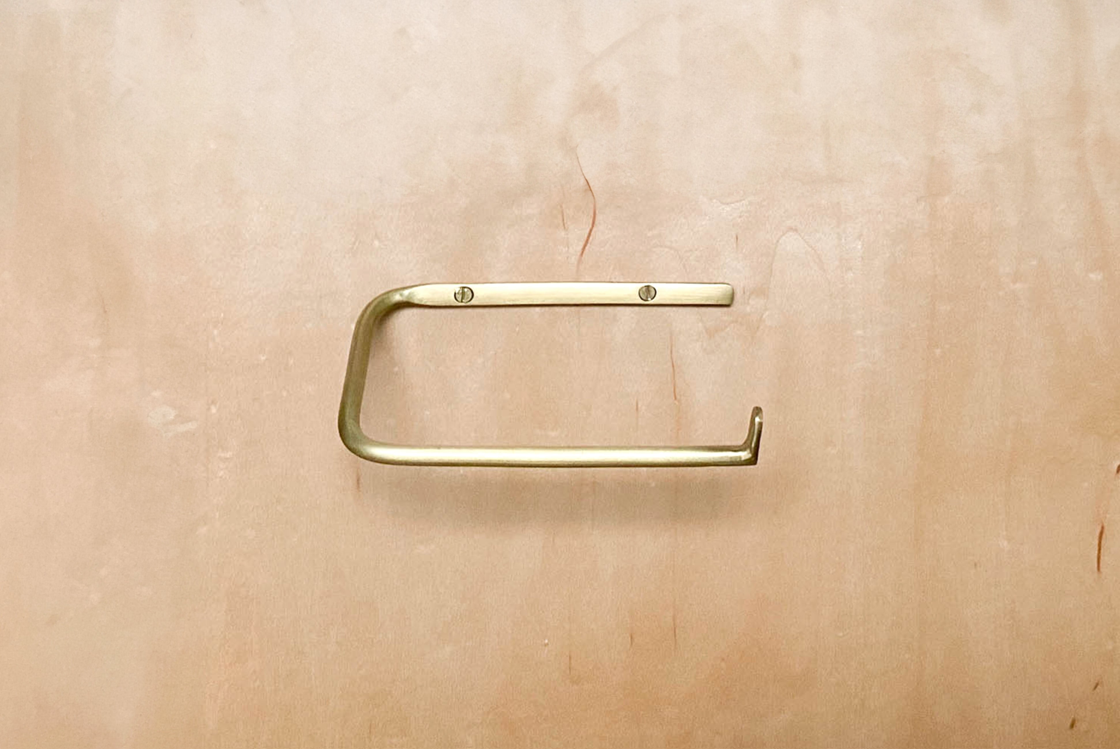 Fog Linen Brass Toilet Paper holder on plywood