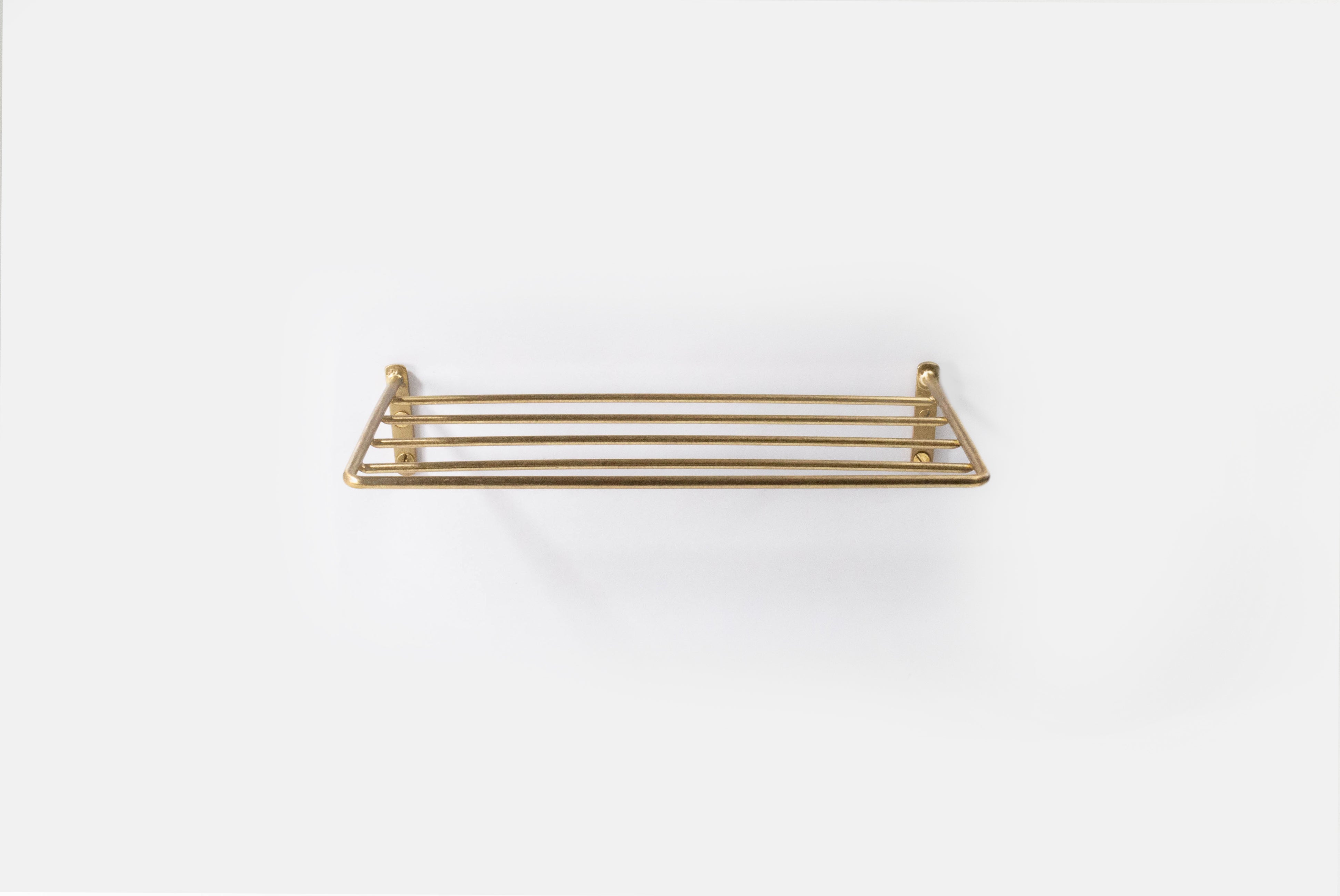 Fog Linen Brass Wire Shelf mounted on white background
