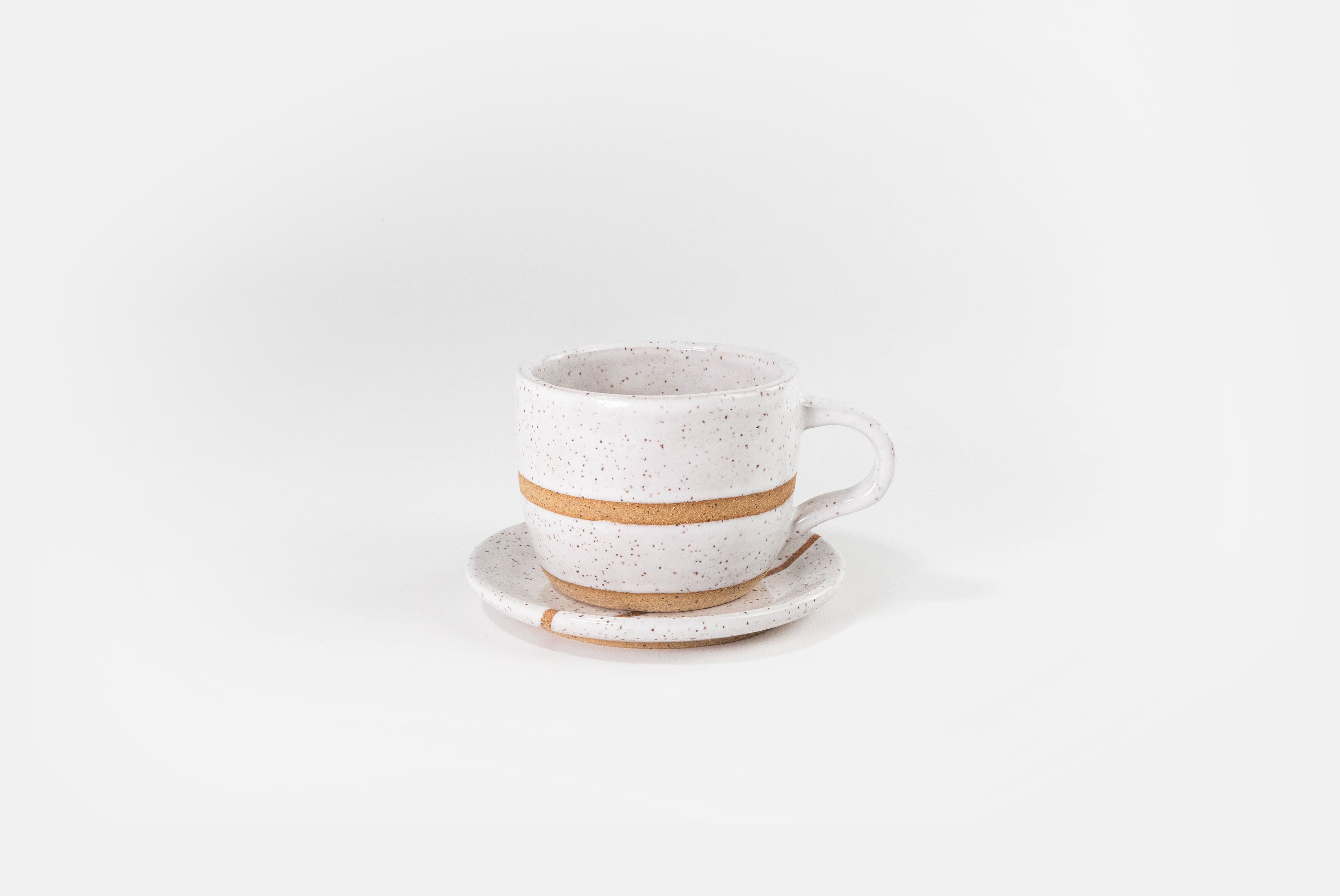 Fred James Pottery white cappuccino coffee cup with saucer dish shown on white background