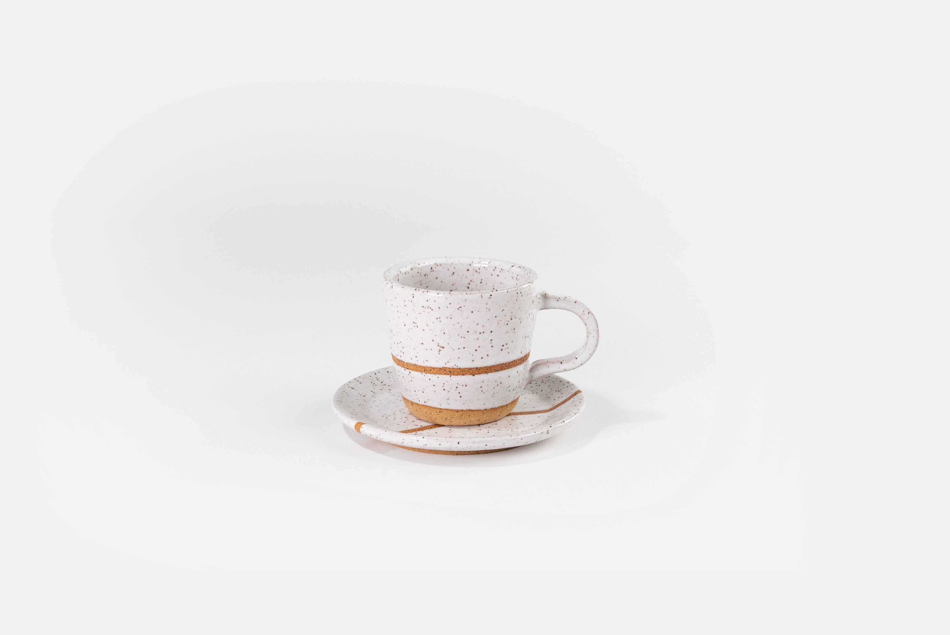 Fred James Pottery white espresso coffee cup with saucer dish shown on white background