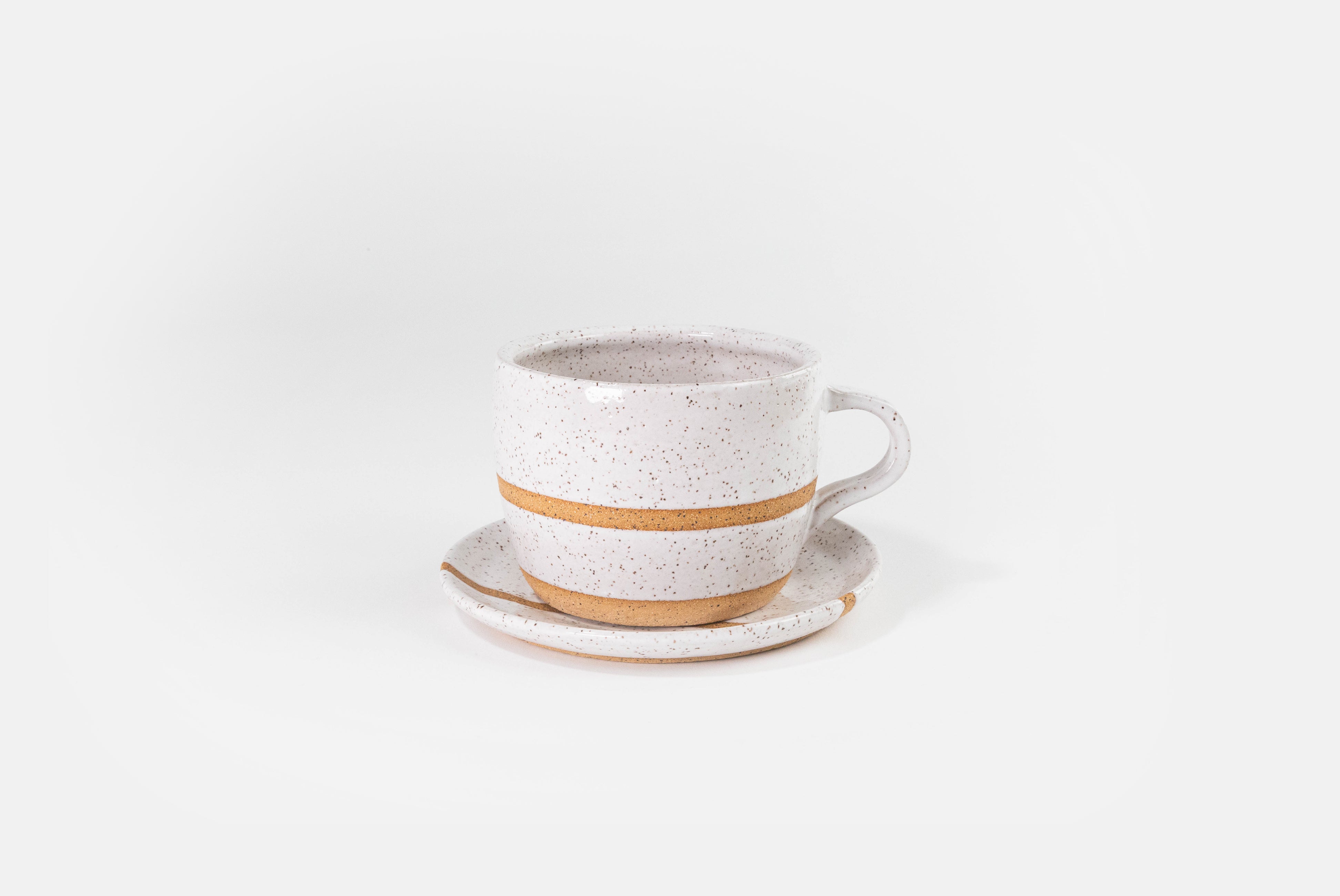 Fred James Pottery white latte coffee cup with saucer dish shown on white background