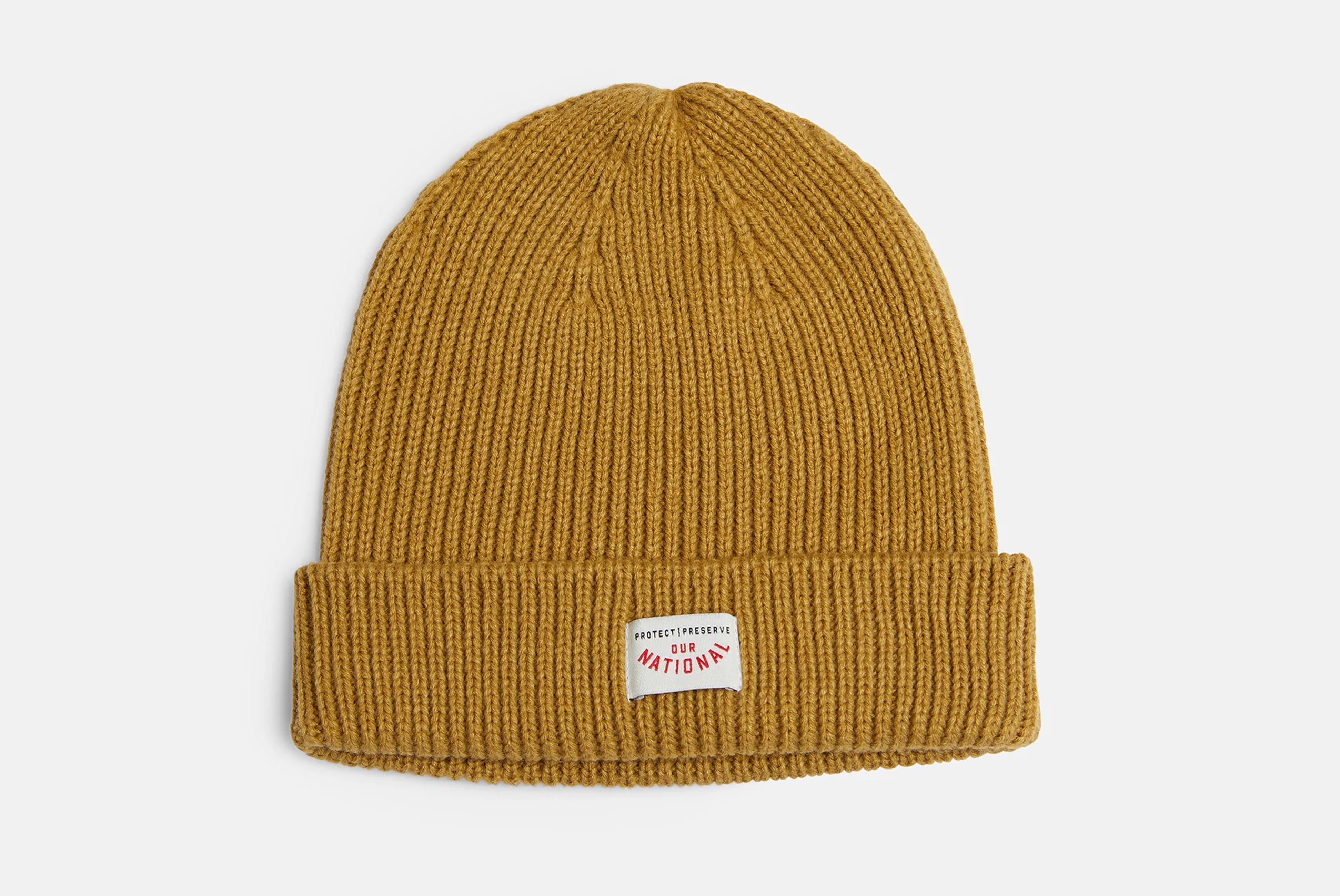 Racer Knit beanie by Pony Rider in clay color shown laying flat on white background
