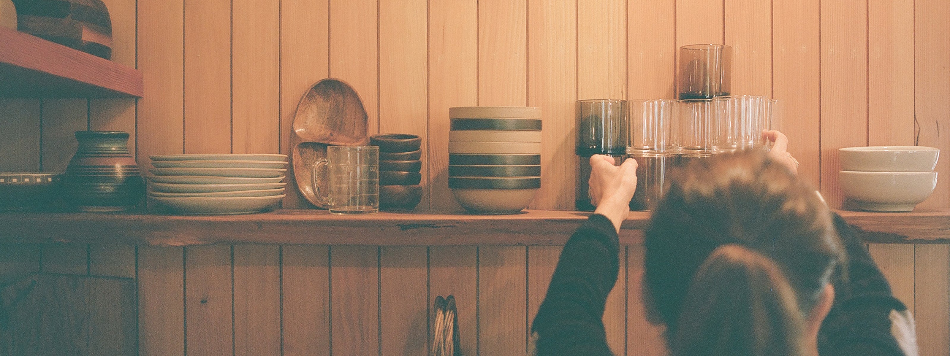 Kitchen shelf with Hasami bowls and glass tumblers at Campover Ranch in Paso Robles, CA