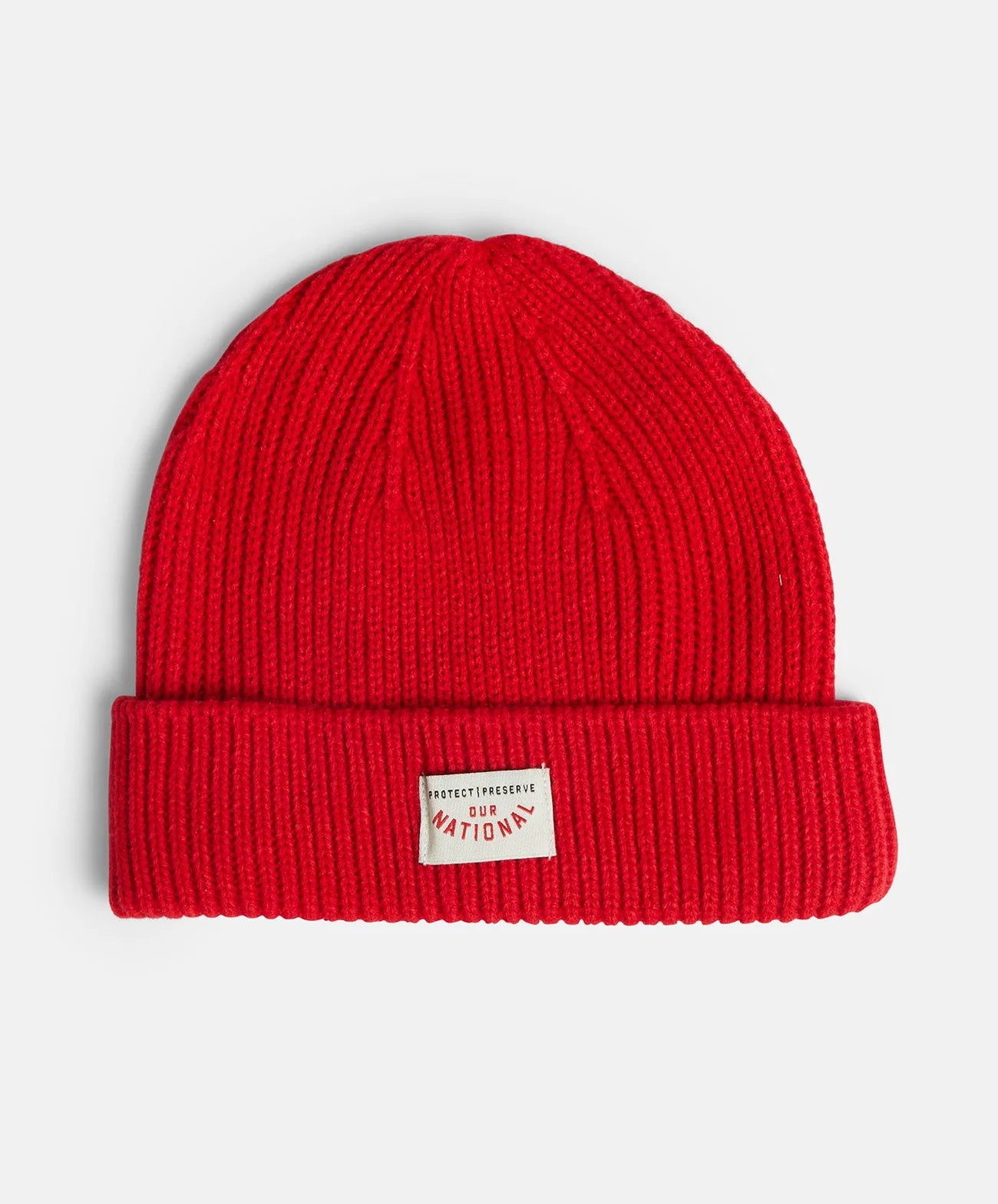Racer Knit beanie by Pony Rider in red color shown laying flat on white background