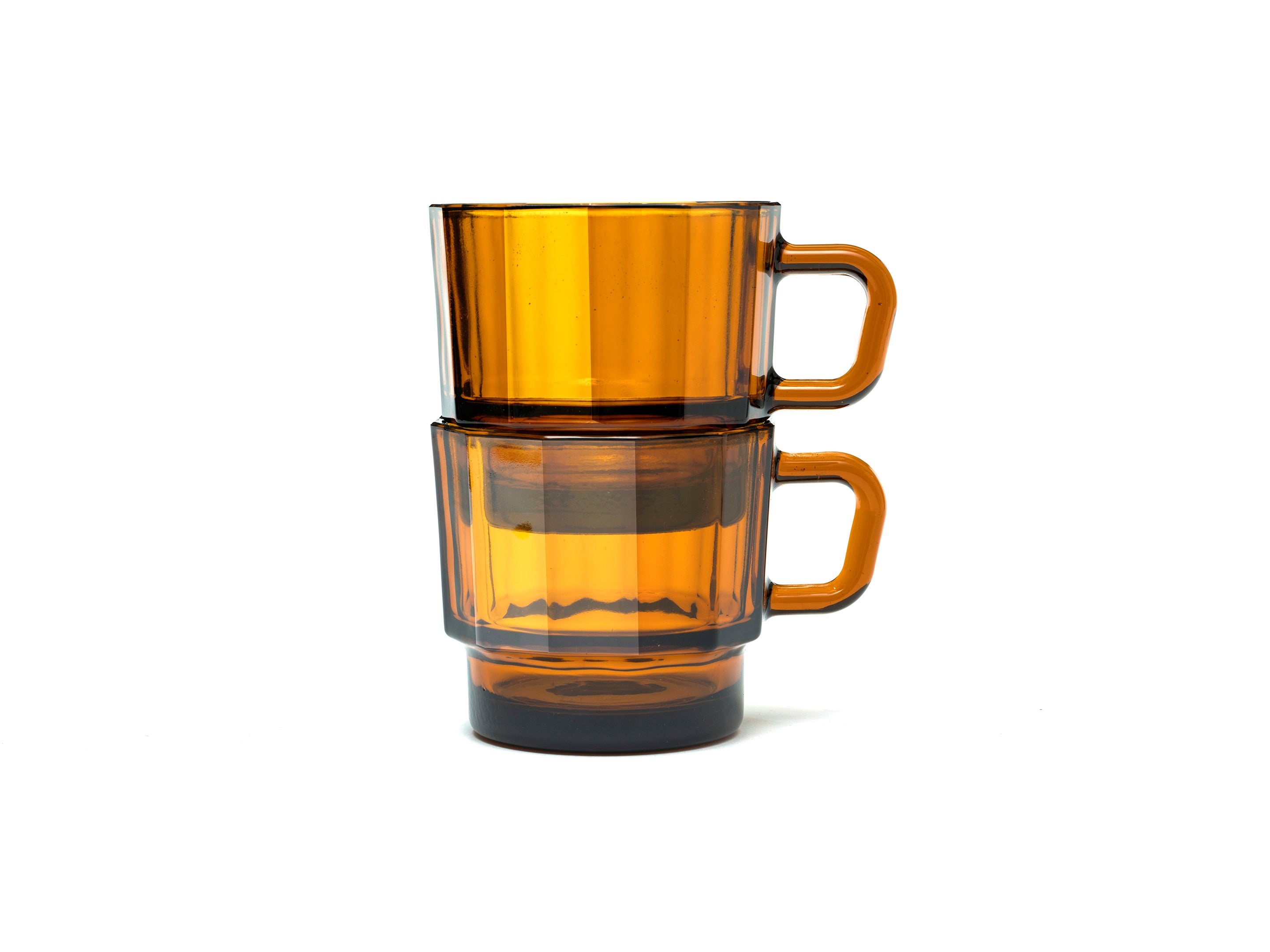 W Glass by HMM shown as a pair in amber color, stacked, on white background
