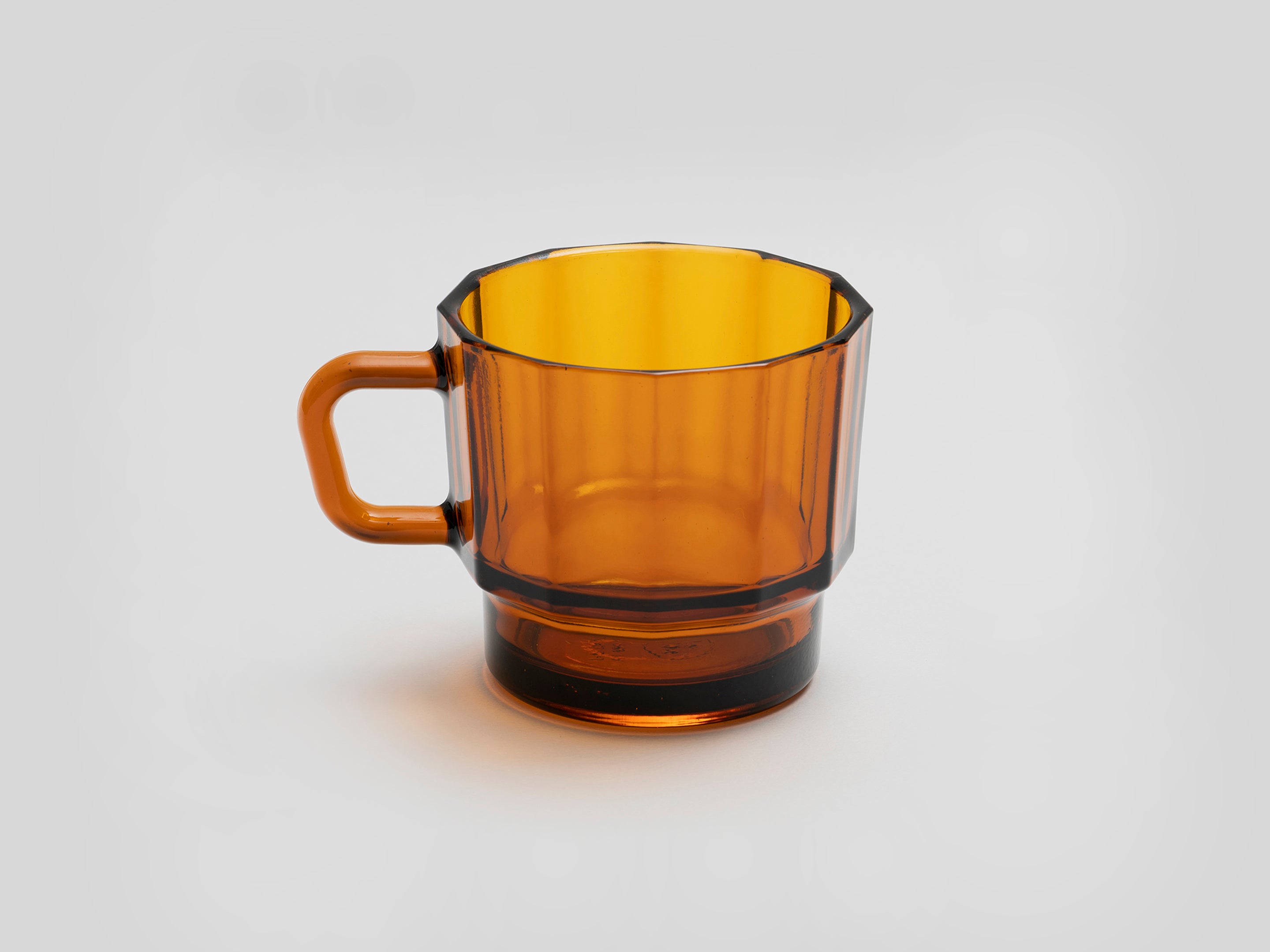 W Glass by HMM shown in amber color on white background