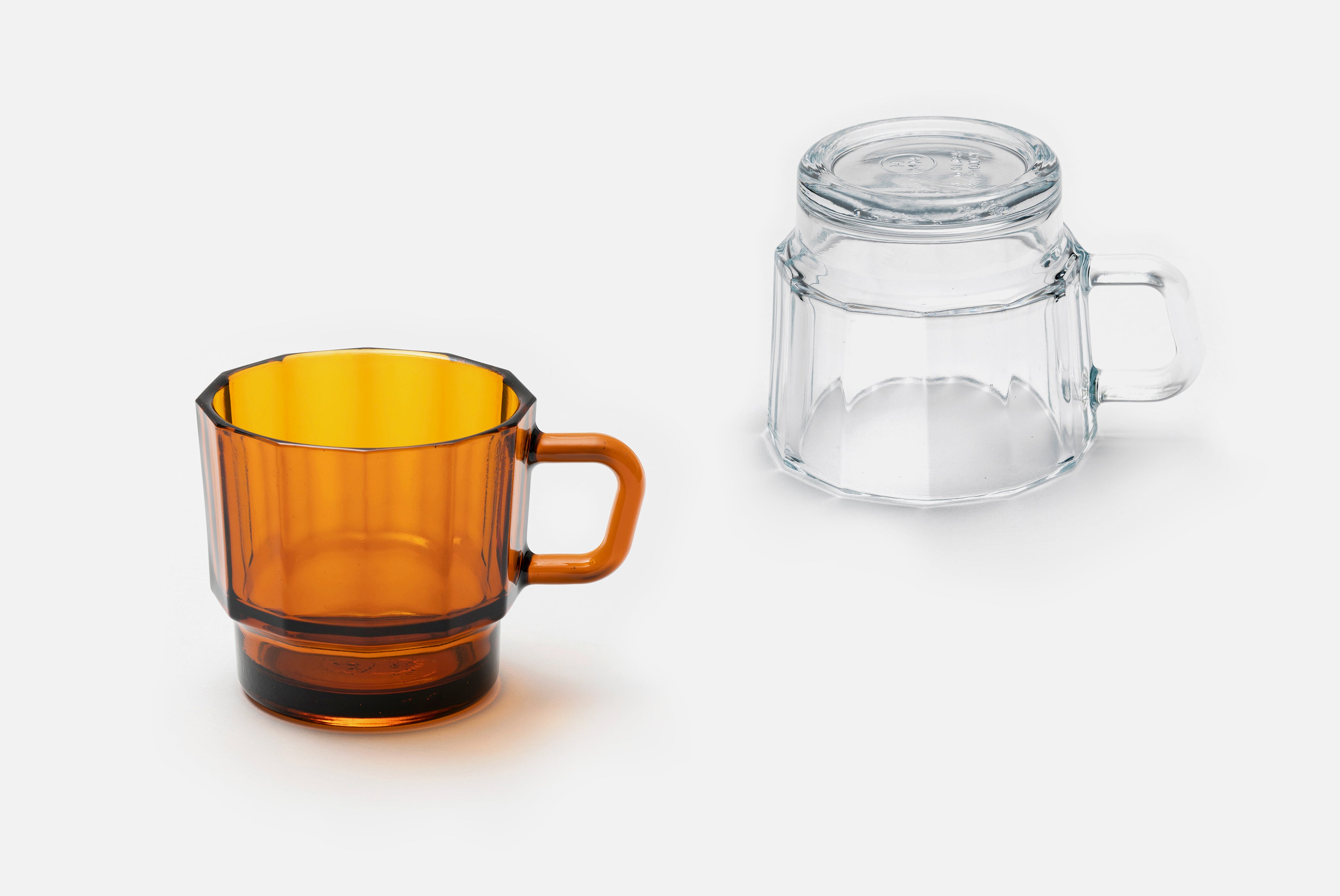 W Glass by HMM shown in clear and amber colors on white background