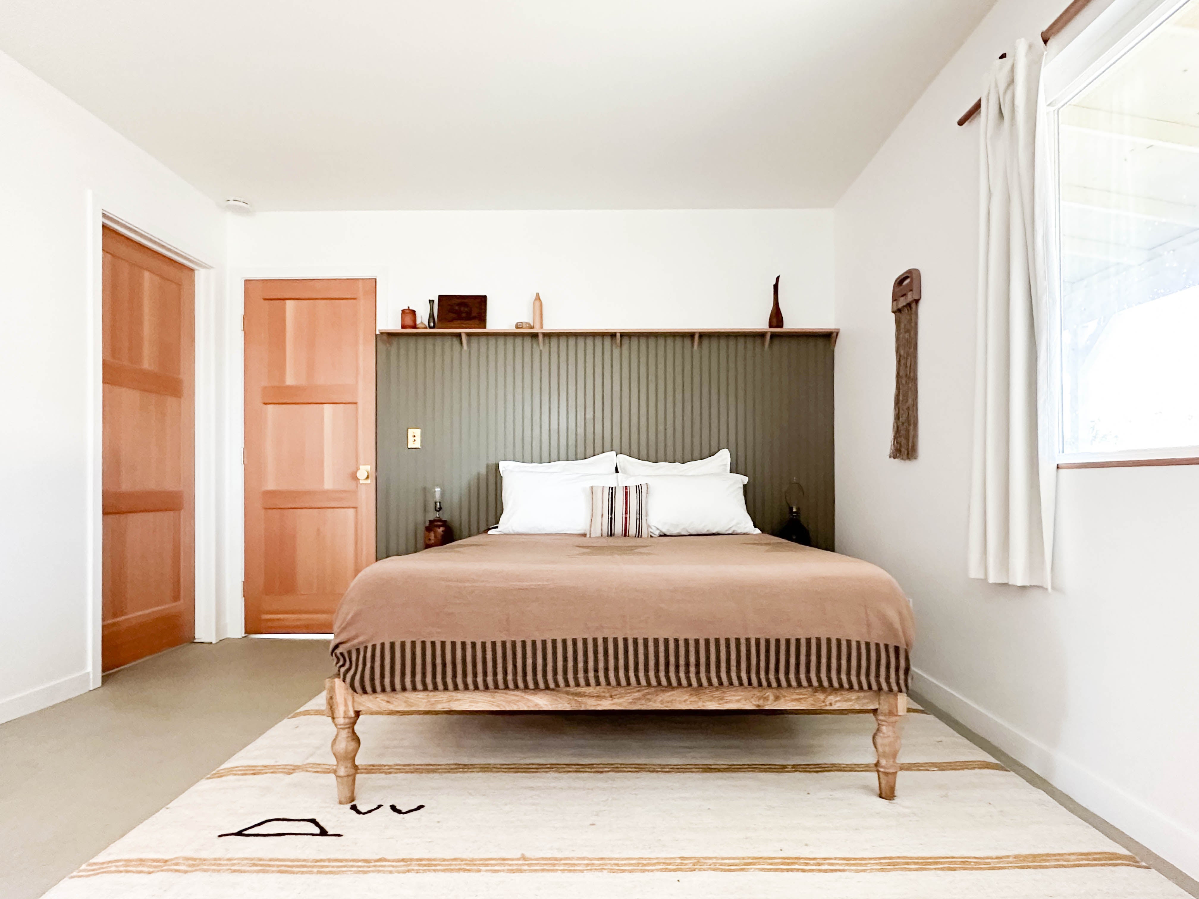 The primary bedroom shown with bed at the Campover Ranch in Paso Robles, California