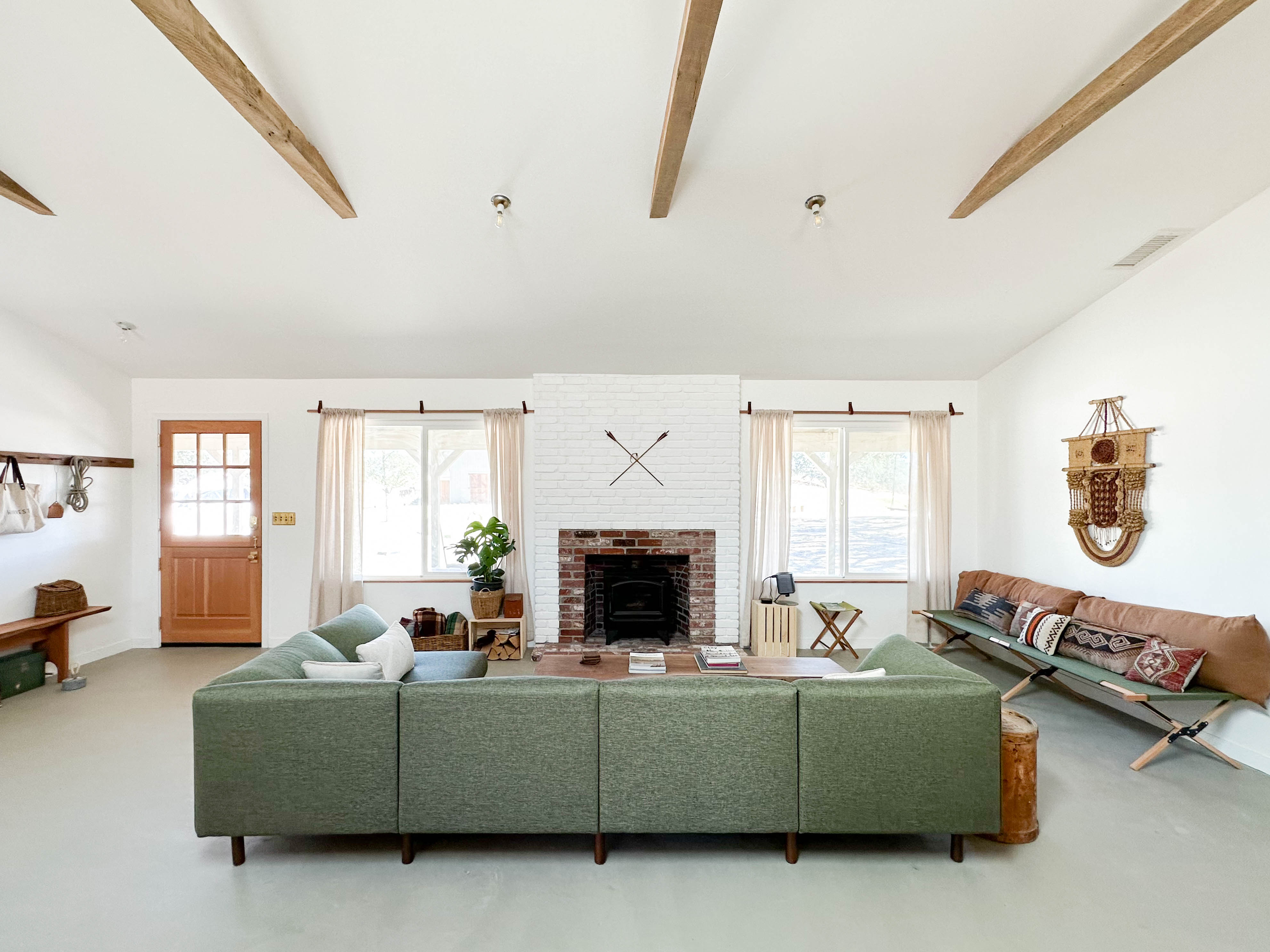 The living room shown with fireplace at the Campover Ranch in Paso Robles, California