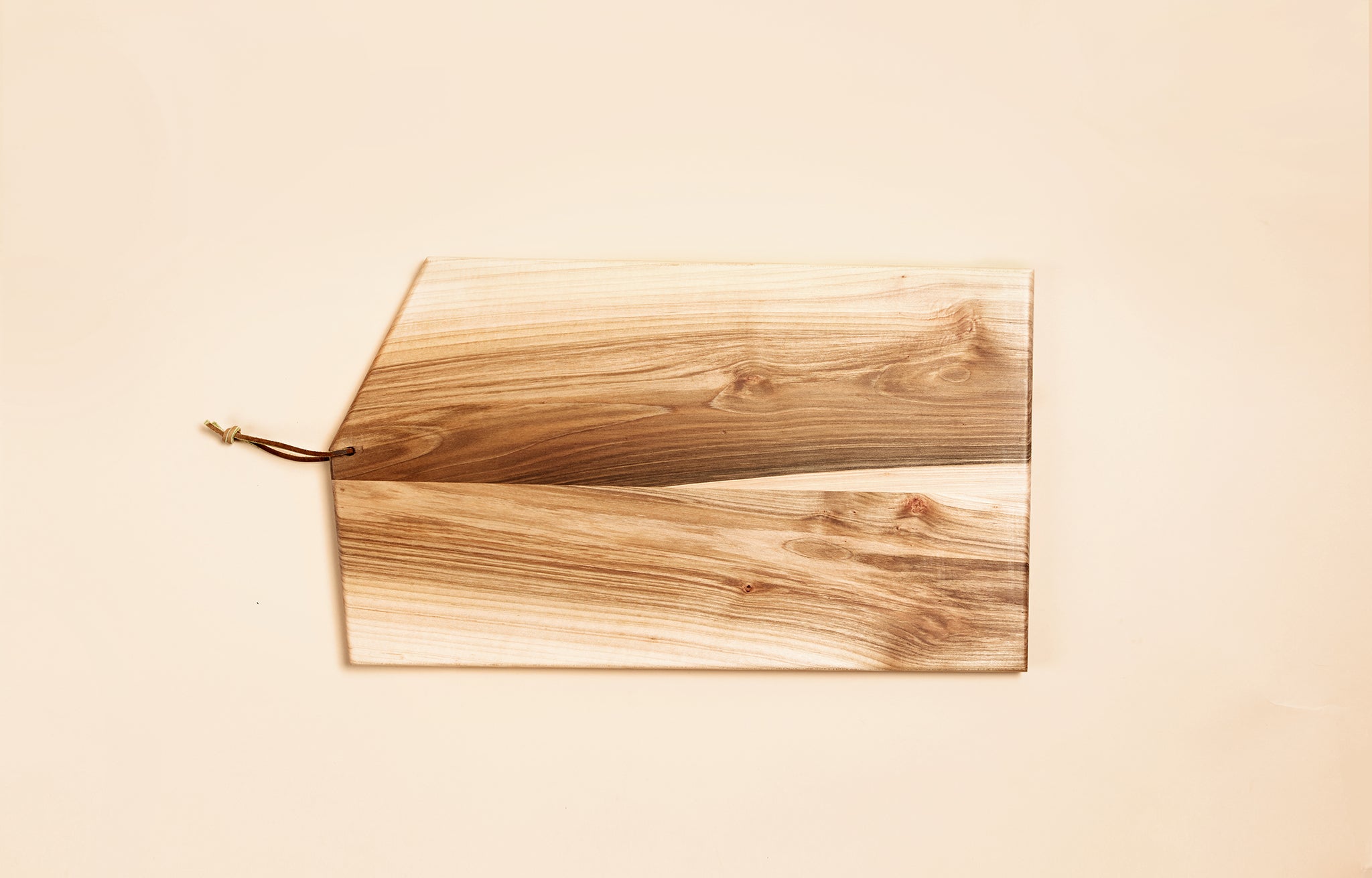 Asymmetric Wood Cutting Board by Campover shown in two tone maple wood