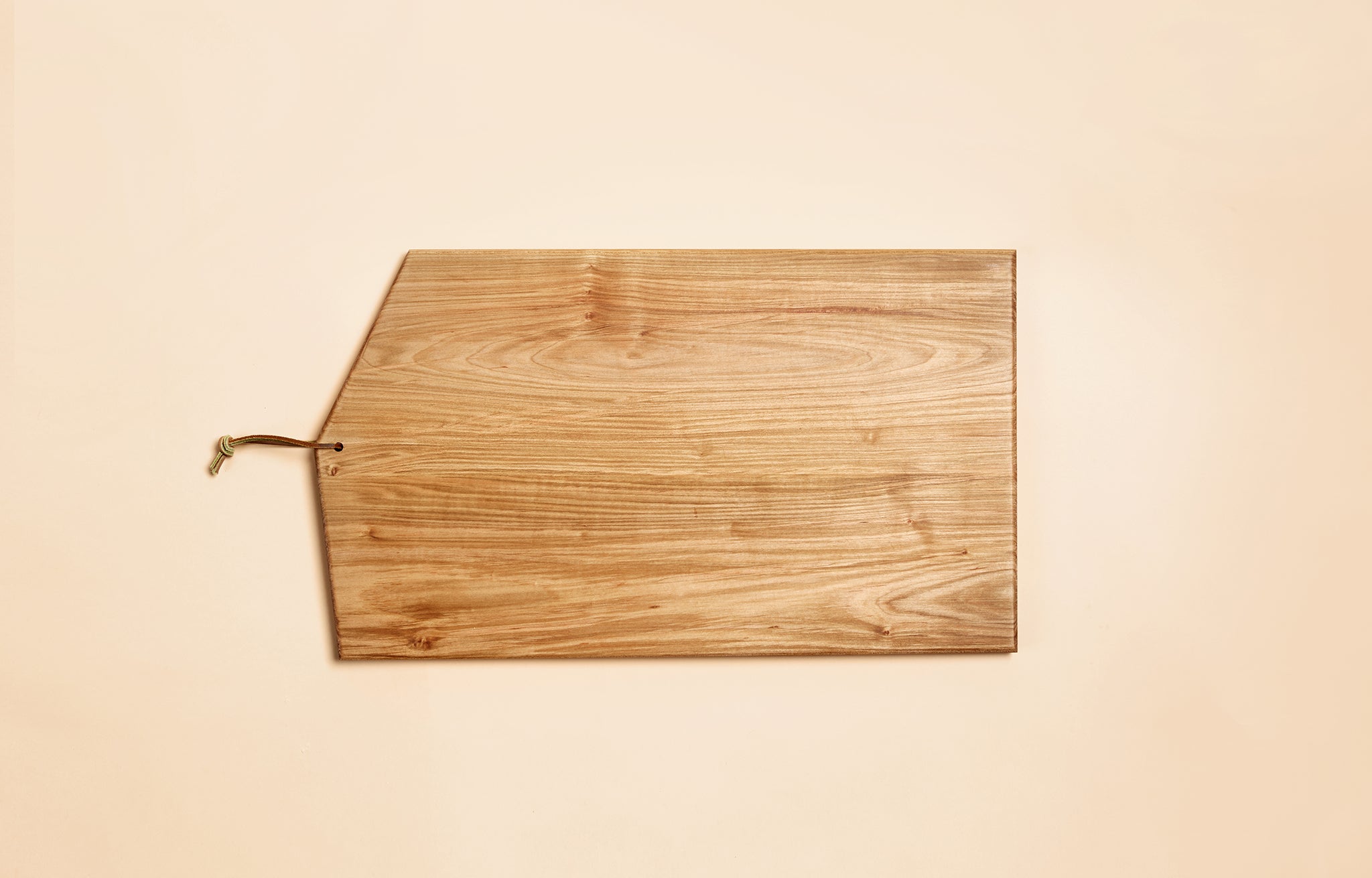 Asymmetric Wood Cutting Board by Campover shown in cherry wood