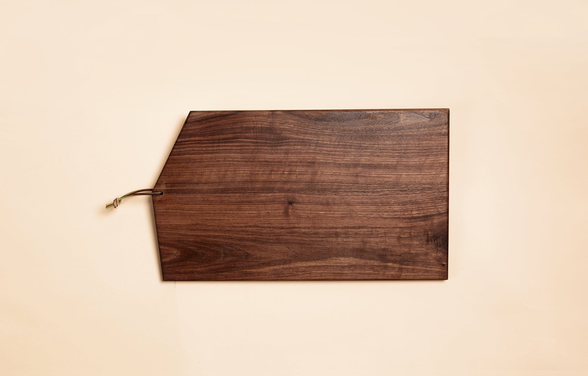 Asymmetric Wood Cutting Board by Campover shown in walnut wood
