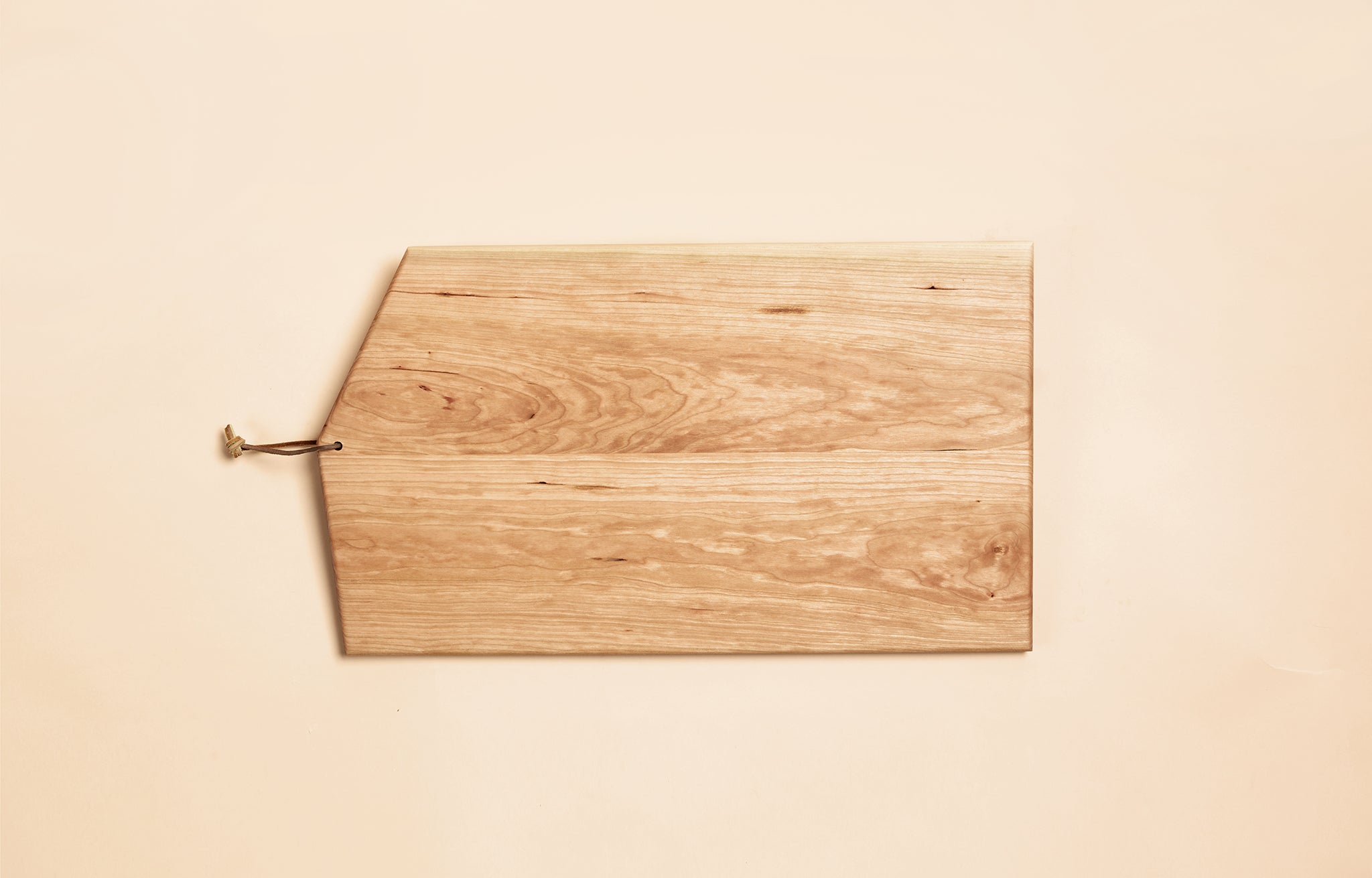 Asymmetric Wood Cutting Board by Campover shown in maple wood