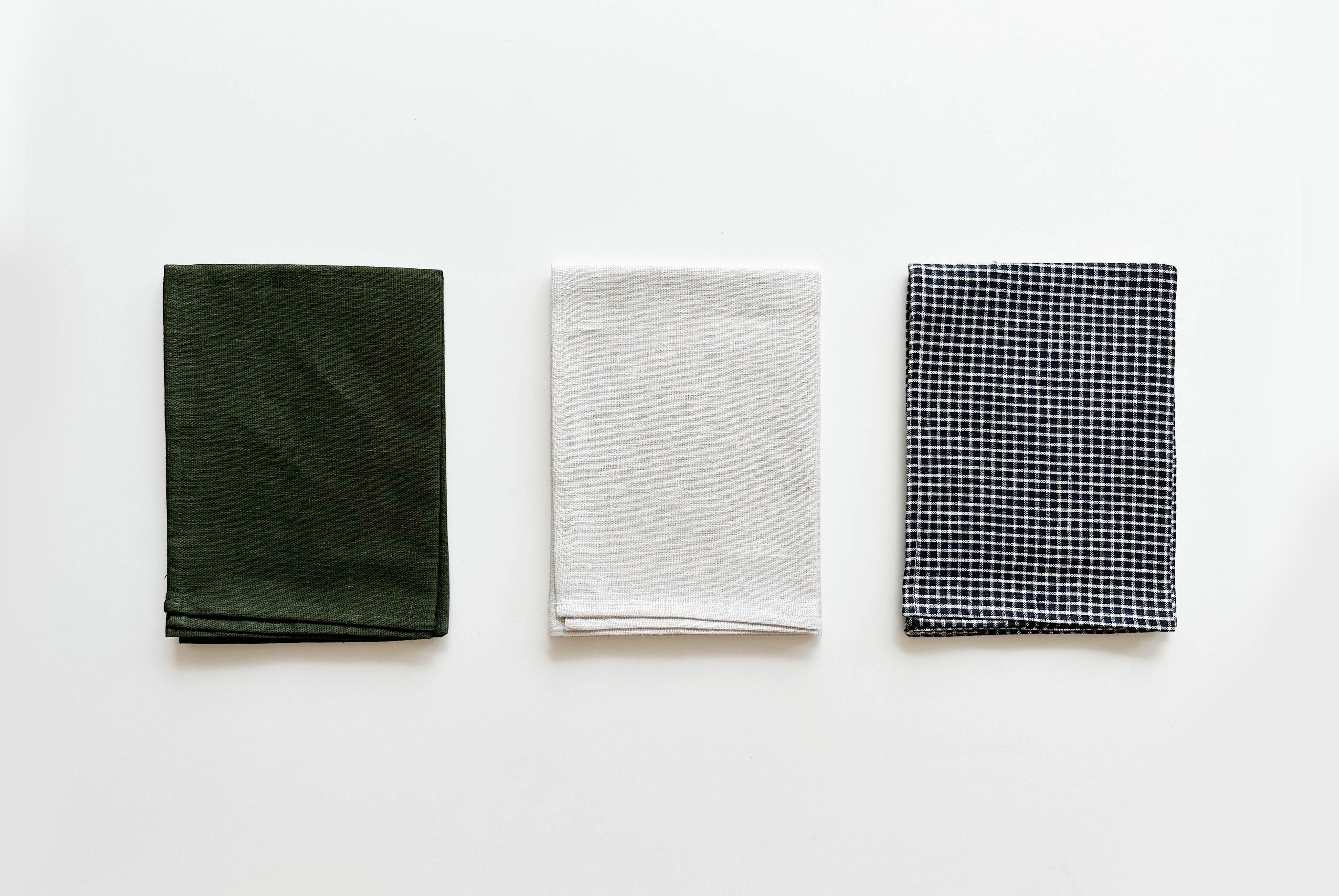 Fog Linen Kitchen Towel shown folded and in three colors | product detail