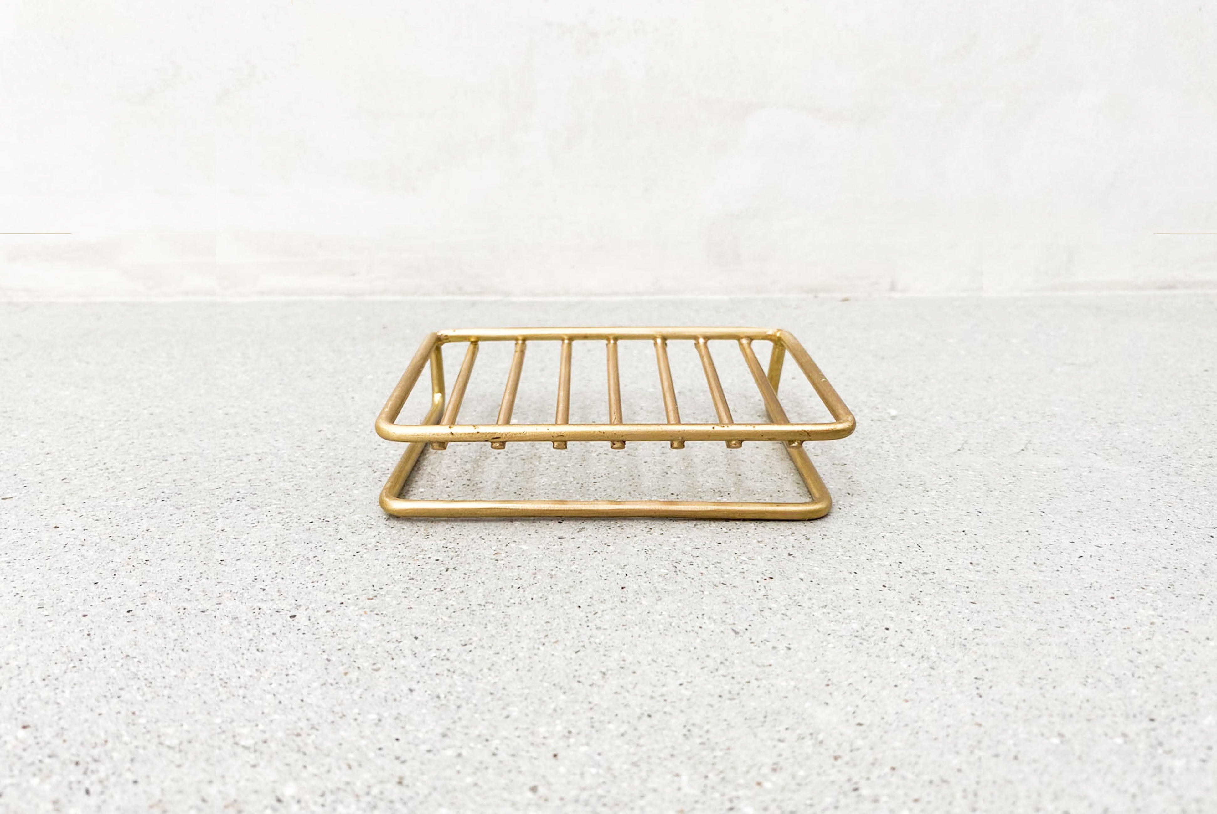 Fog Linen Brass Wire Soap Dish shown on stone surface