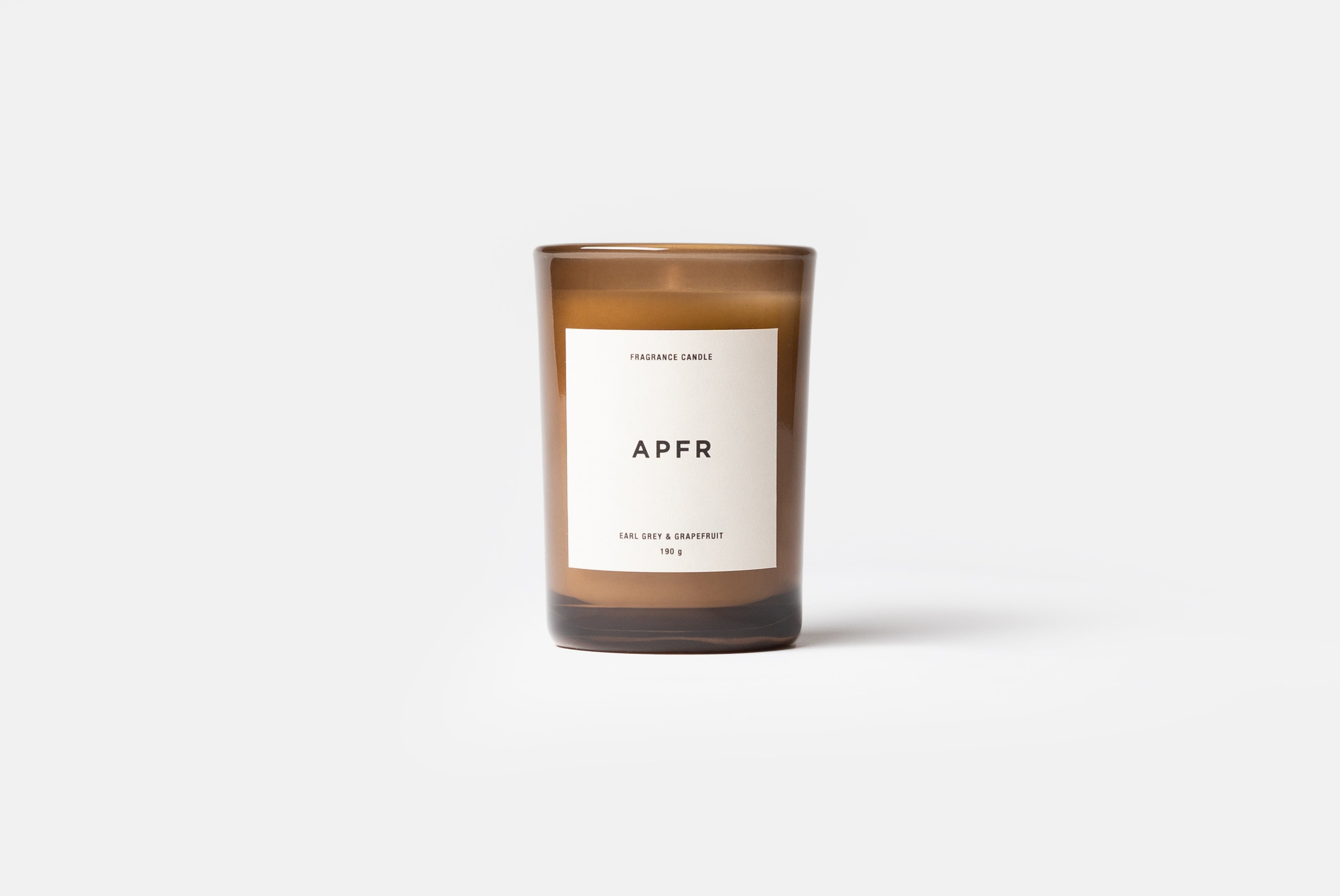 APFR Fragrance Candle in Earl Grey + Grapefruit scent, shown on white background