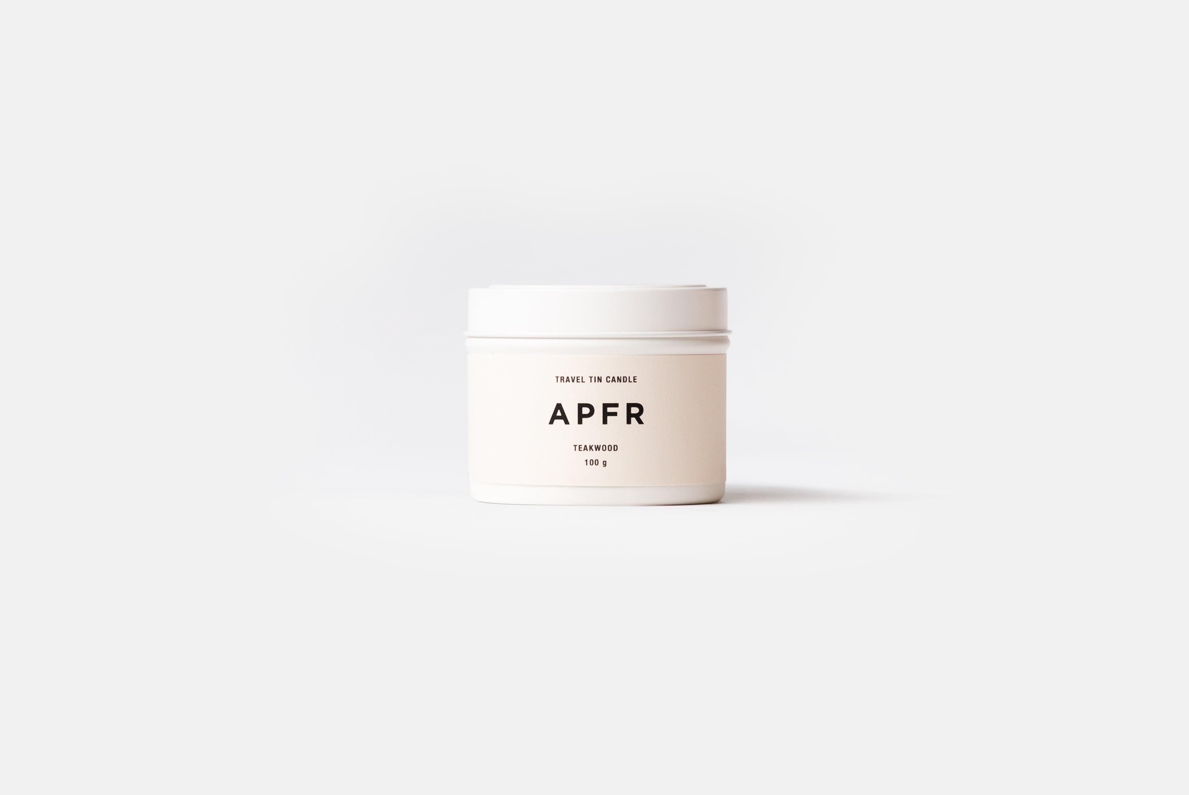 APFR Travel Tin Candle in Teakwood scent, shown on white background