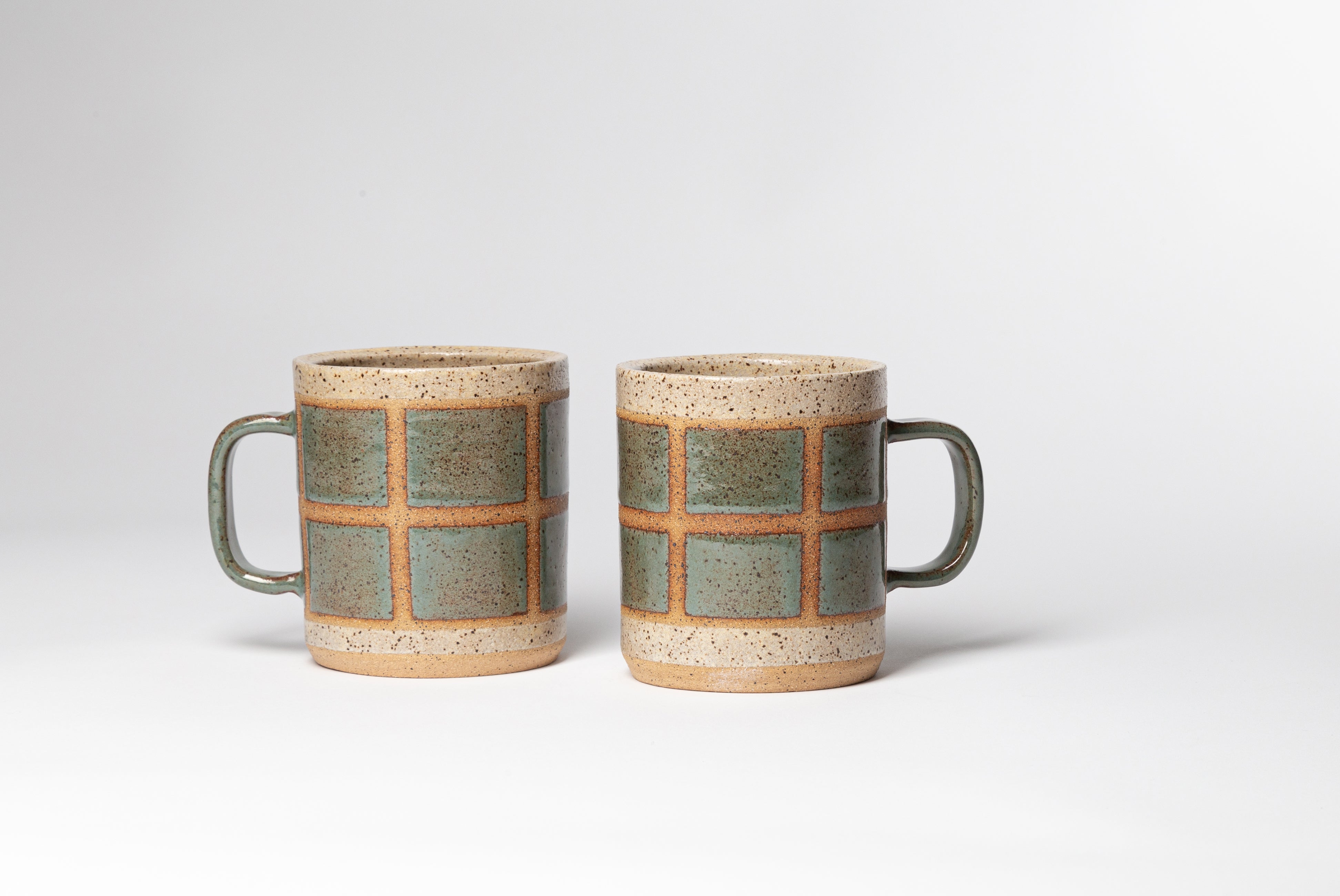 Two Ceramic Camp Mugs by Campover in collaboration with Fred James Pottery, shown on white background