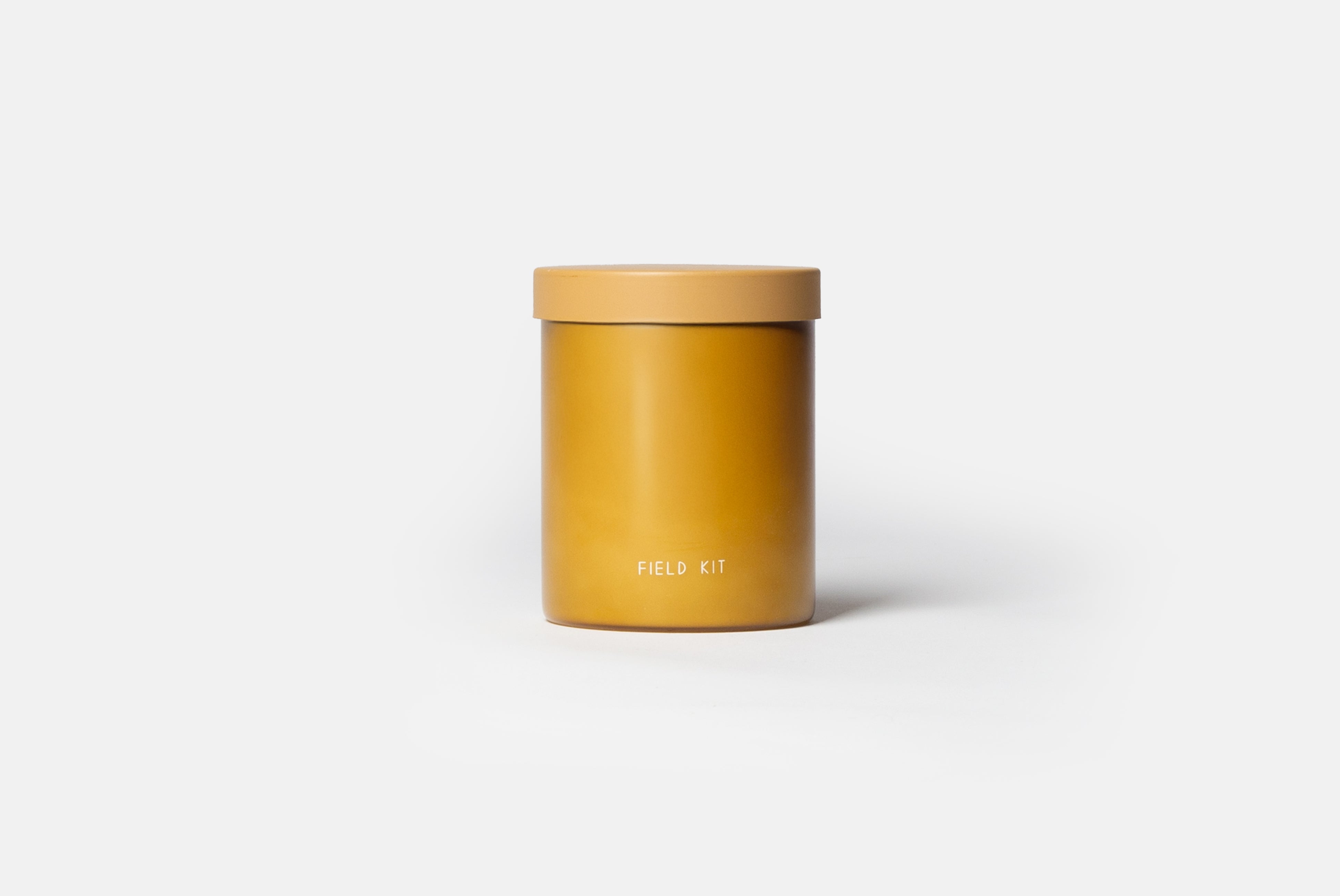 The Beekeeper Candle by Field Kit, shown on white background