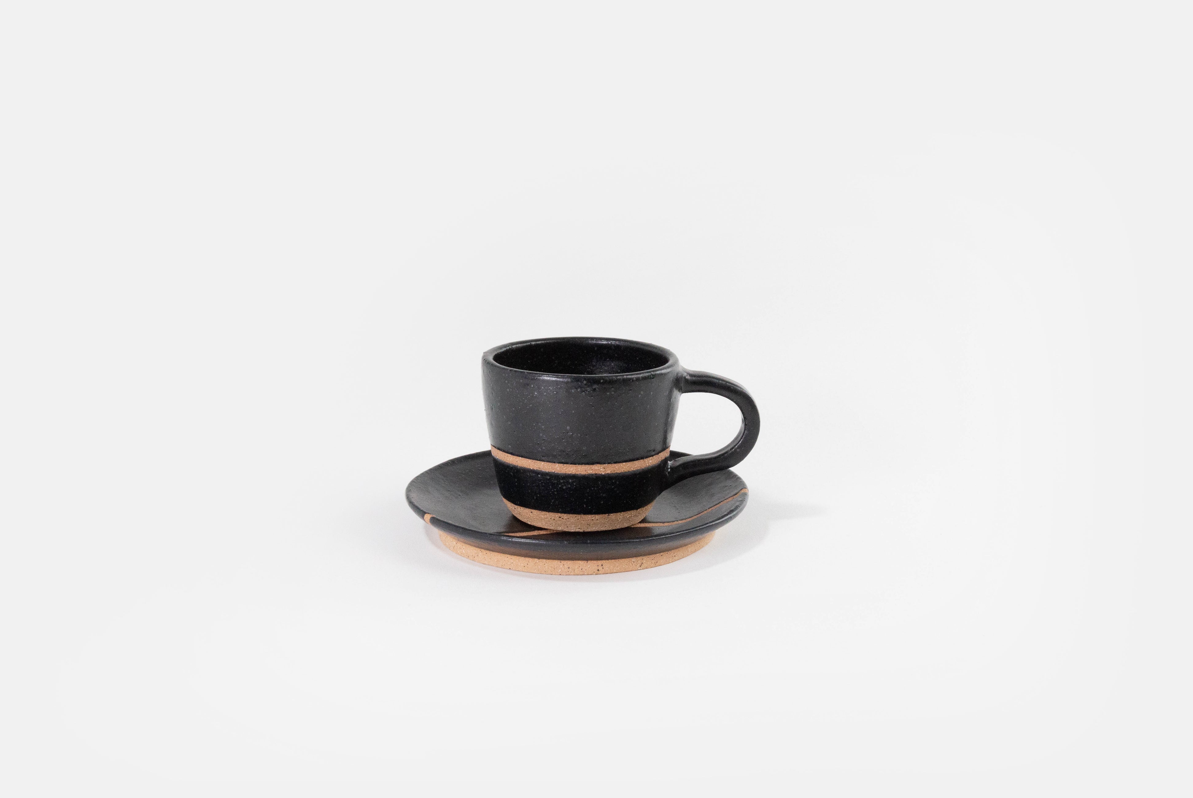 Fred James Pottery matte black espresso cup with saucer dish shown on white background