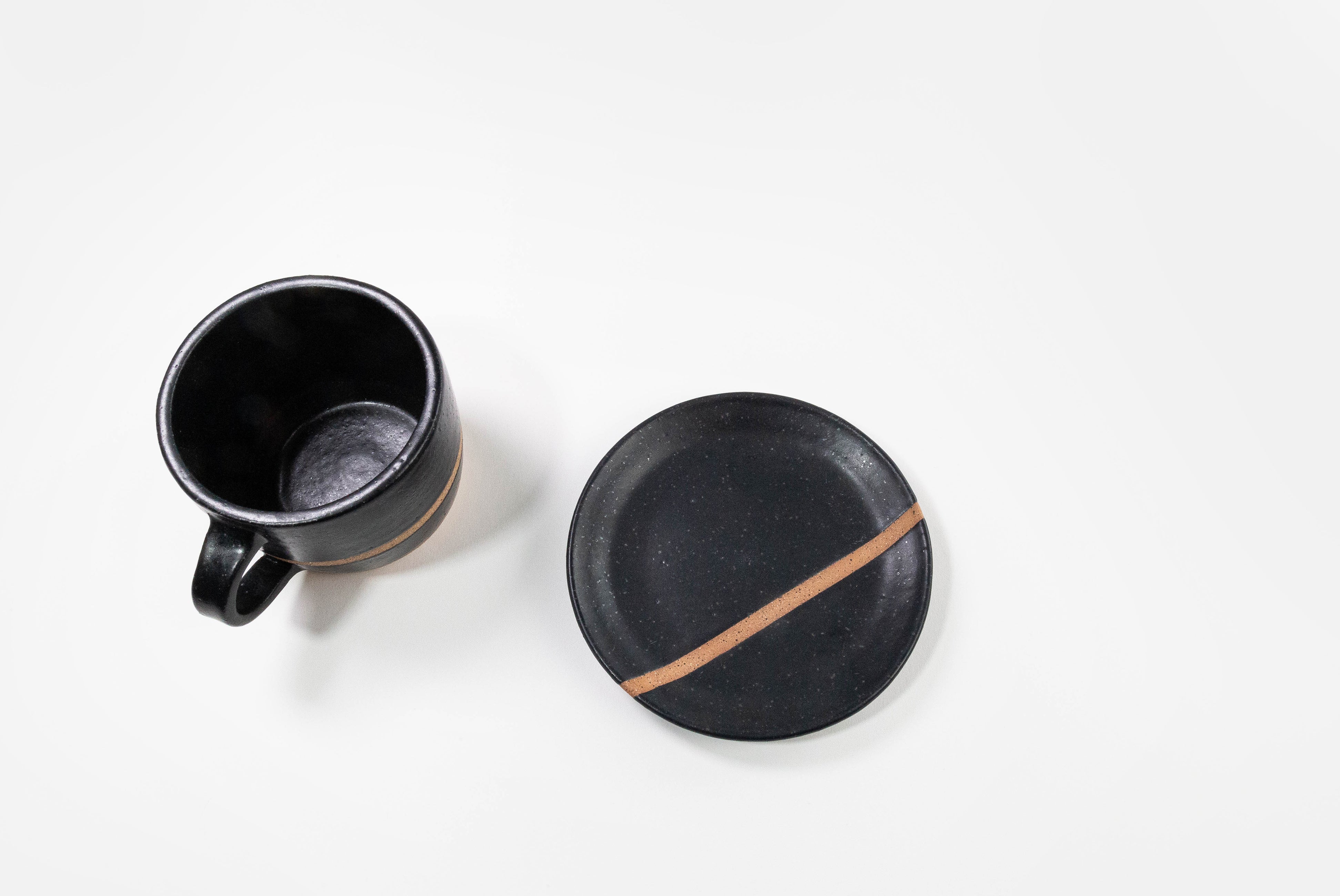 Fred James Pottery matte black espresso cappuccino latte coffee cups with saucer dish shown from top view