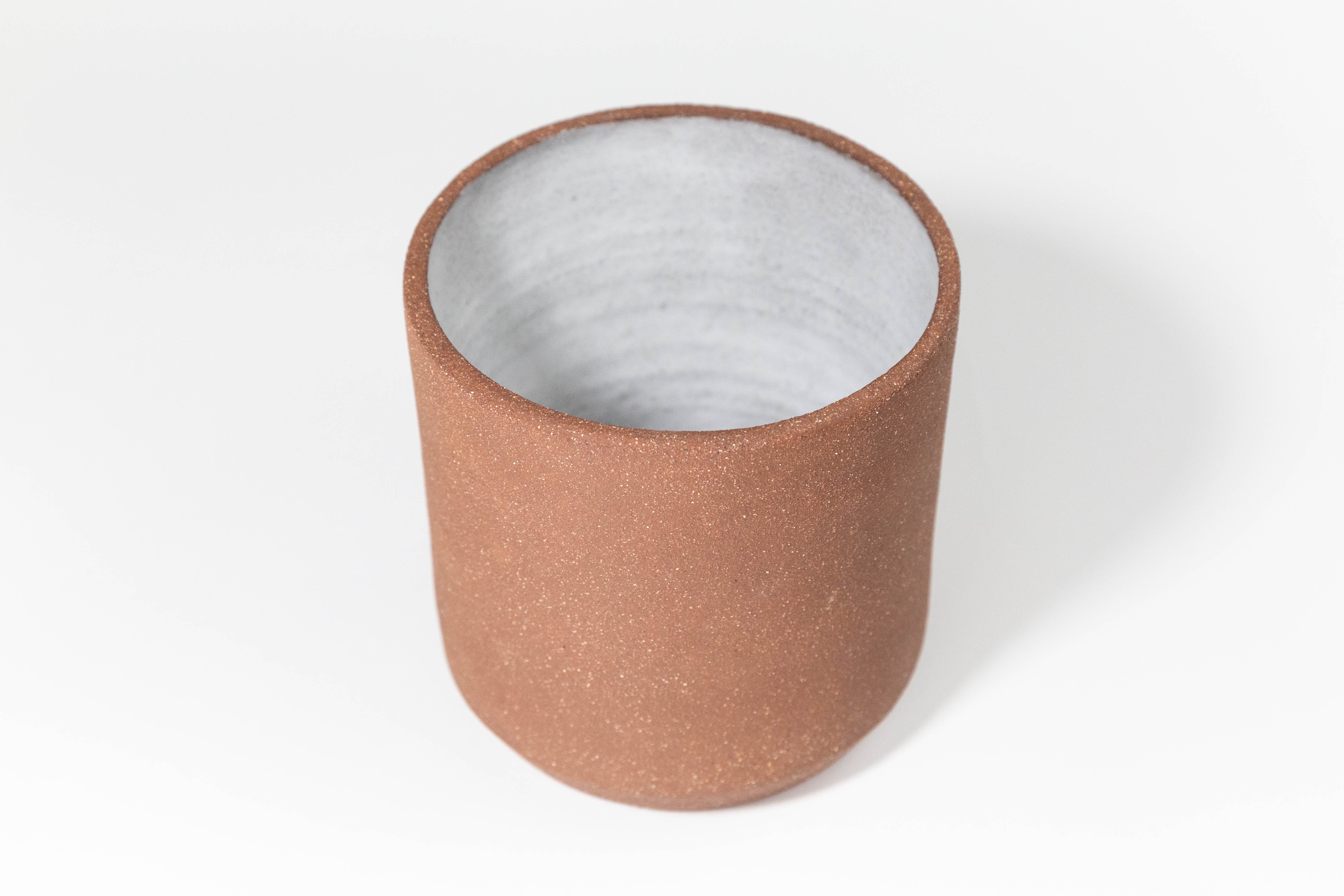 Ceramic Utensil Holder by Fred James Pottery shown with empty and from above angle on white background