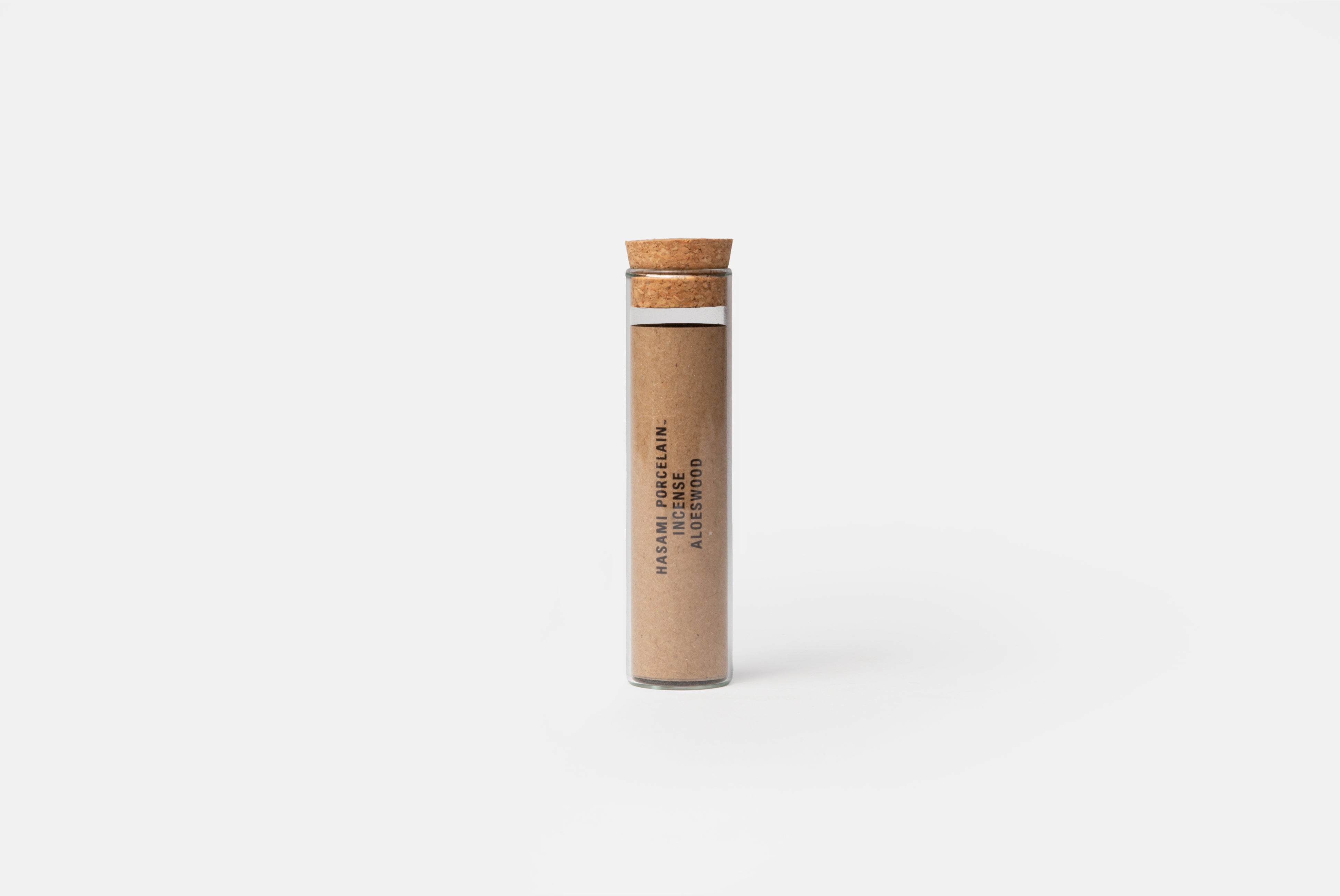 Hasami Porcelain Incense in Aloeswood shown in glass packaging with cork