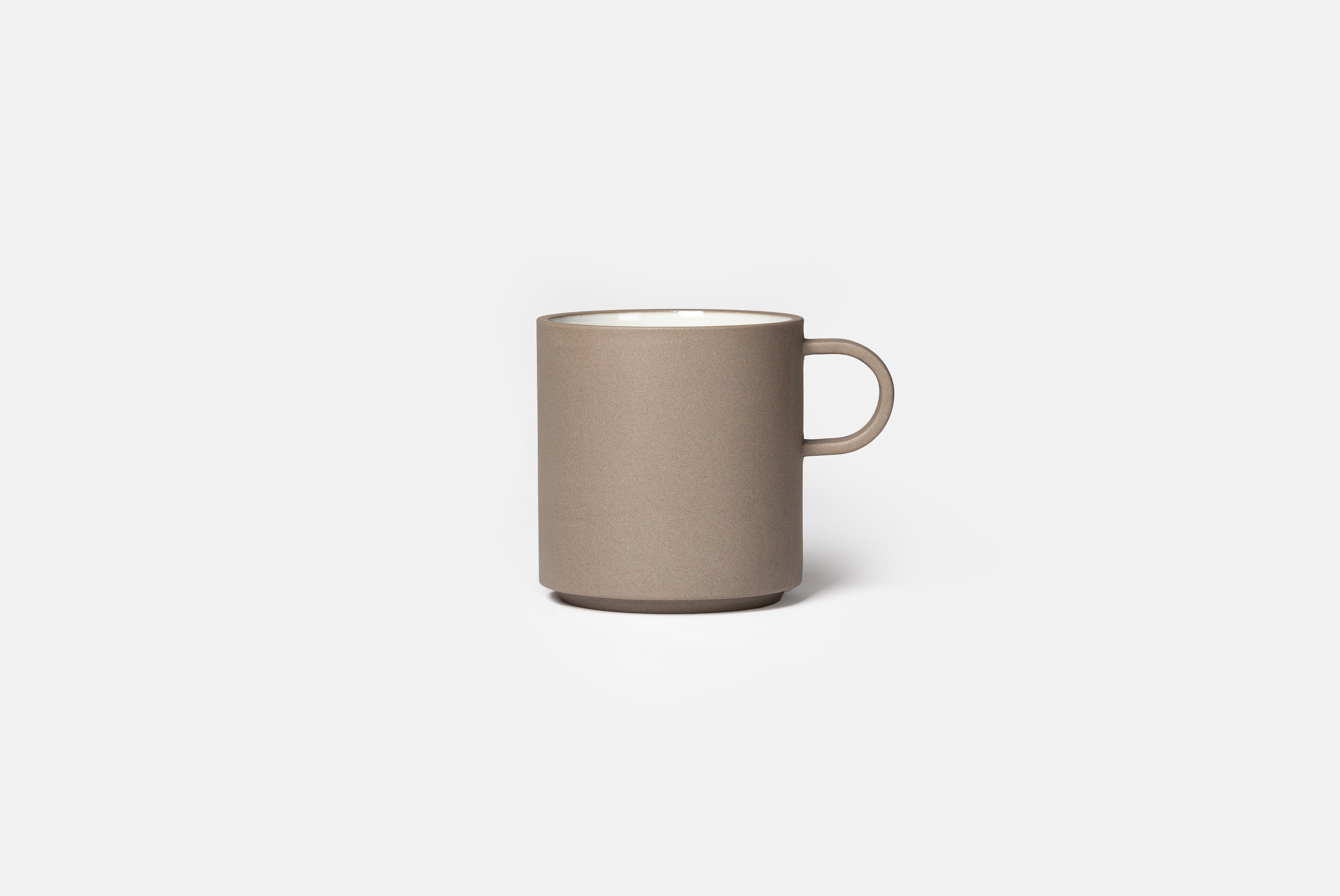 Hasami Porcelain Grey Collection Mug size medium with white interior on white background. Grey modern ceramic porcelain mug with round handle.
