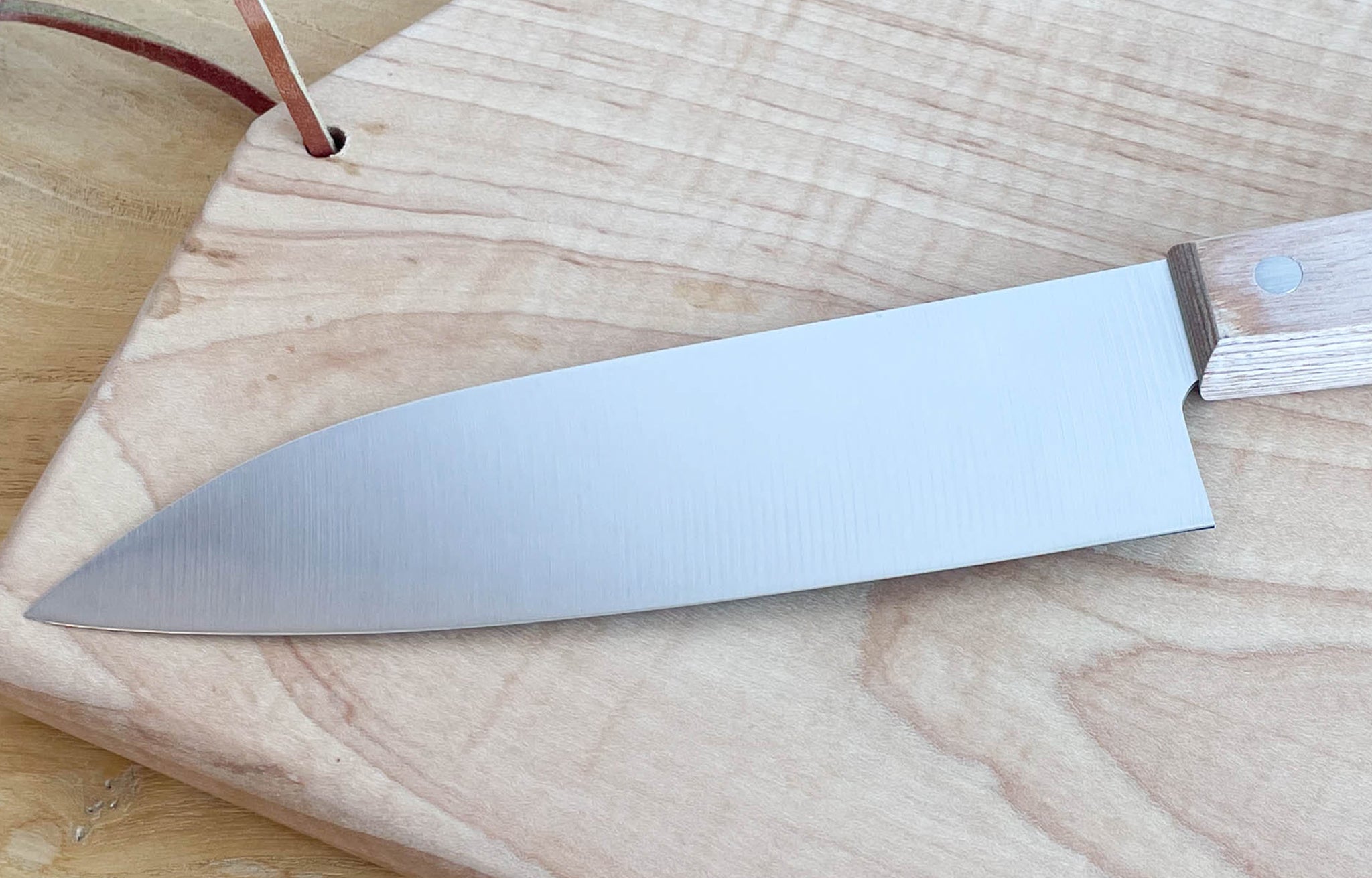 Back of Niwaki Chef's Knife shown on cutting board | lifestyle