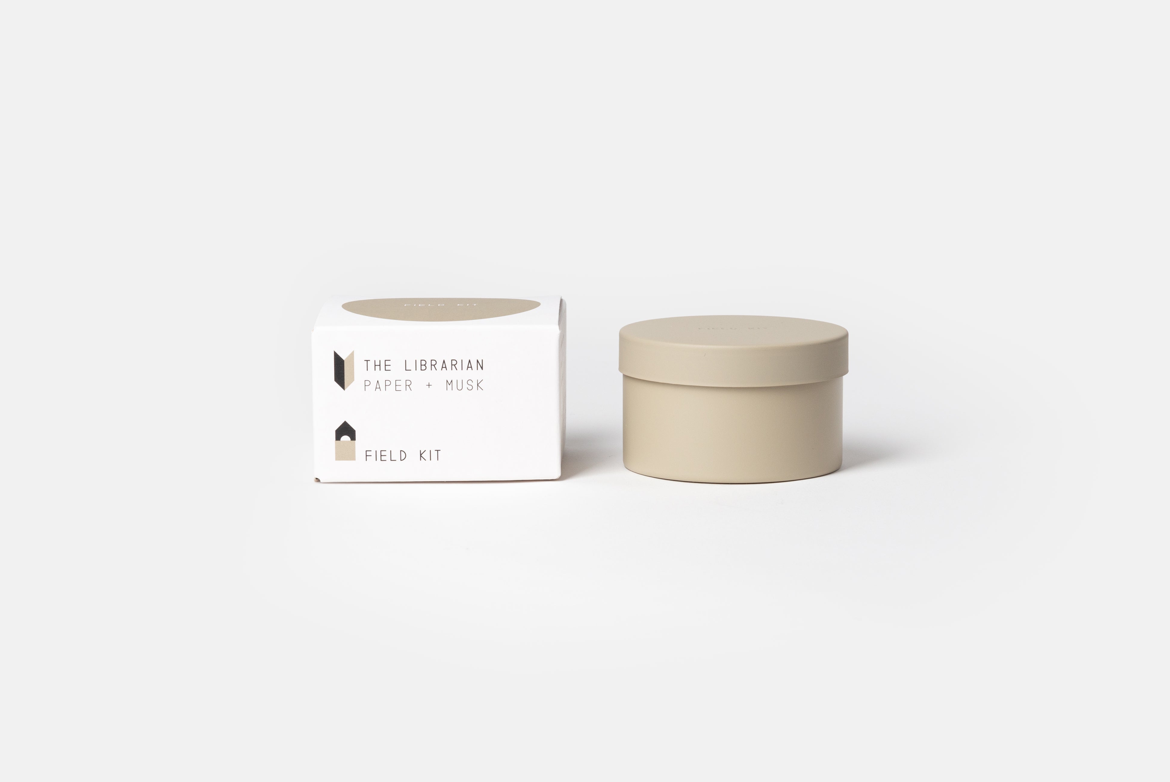 The Librarian Candle by Field Kit, shown next to packaging on white background