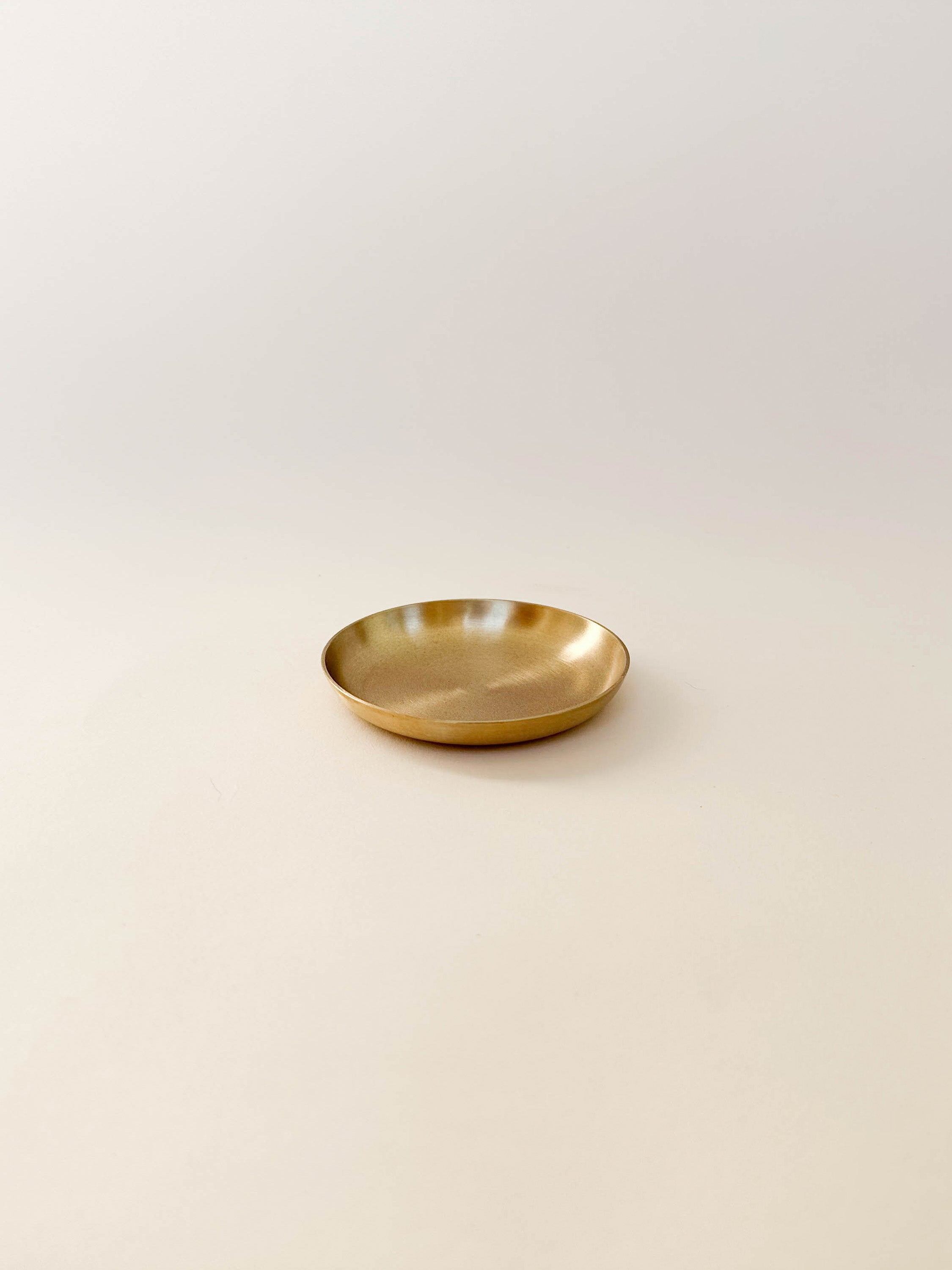 Fog Linen Brass Plate shown in medium size | lifestyle