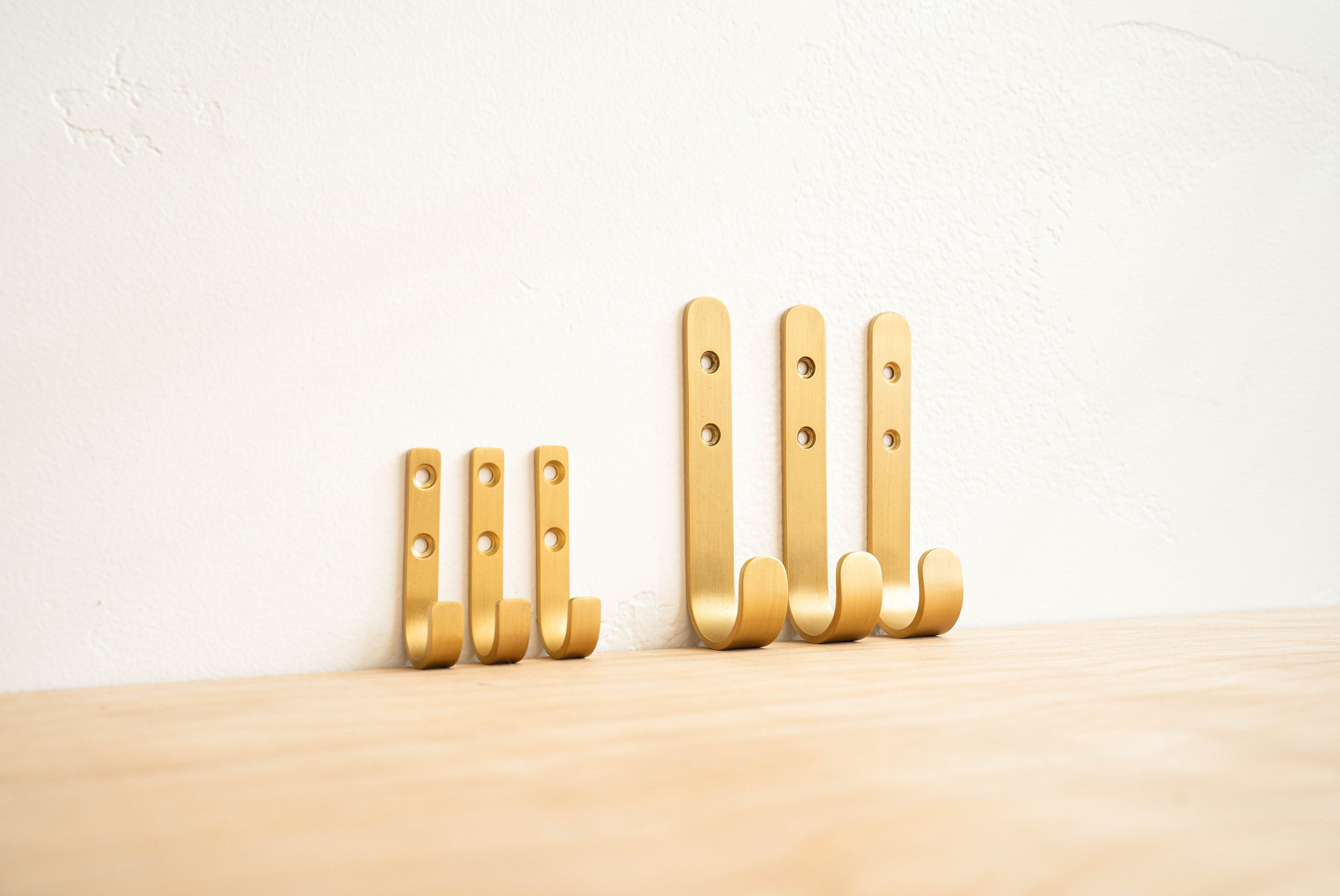 Simple Brass J Hook, showing both large and small sizes | product detail