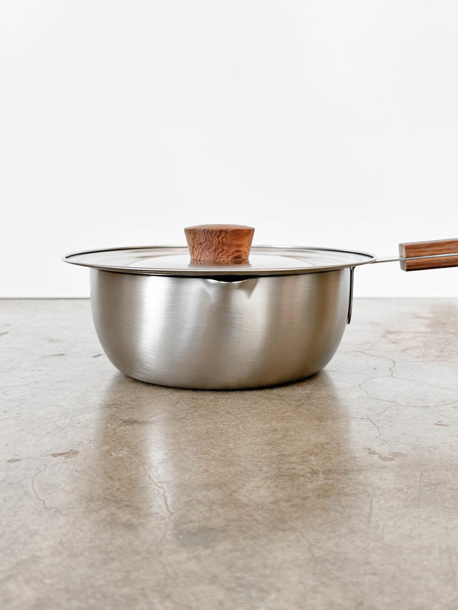 Stainless Steel Pot with Wood Handle showing spout | lifestyle