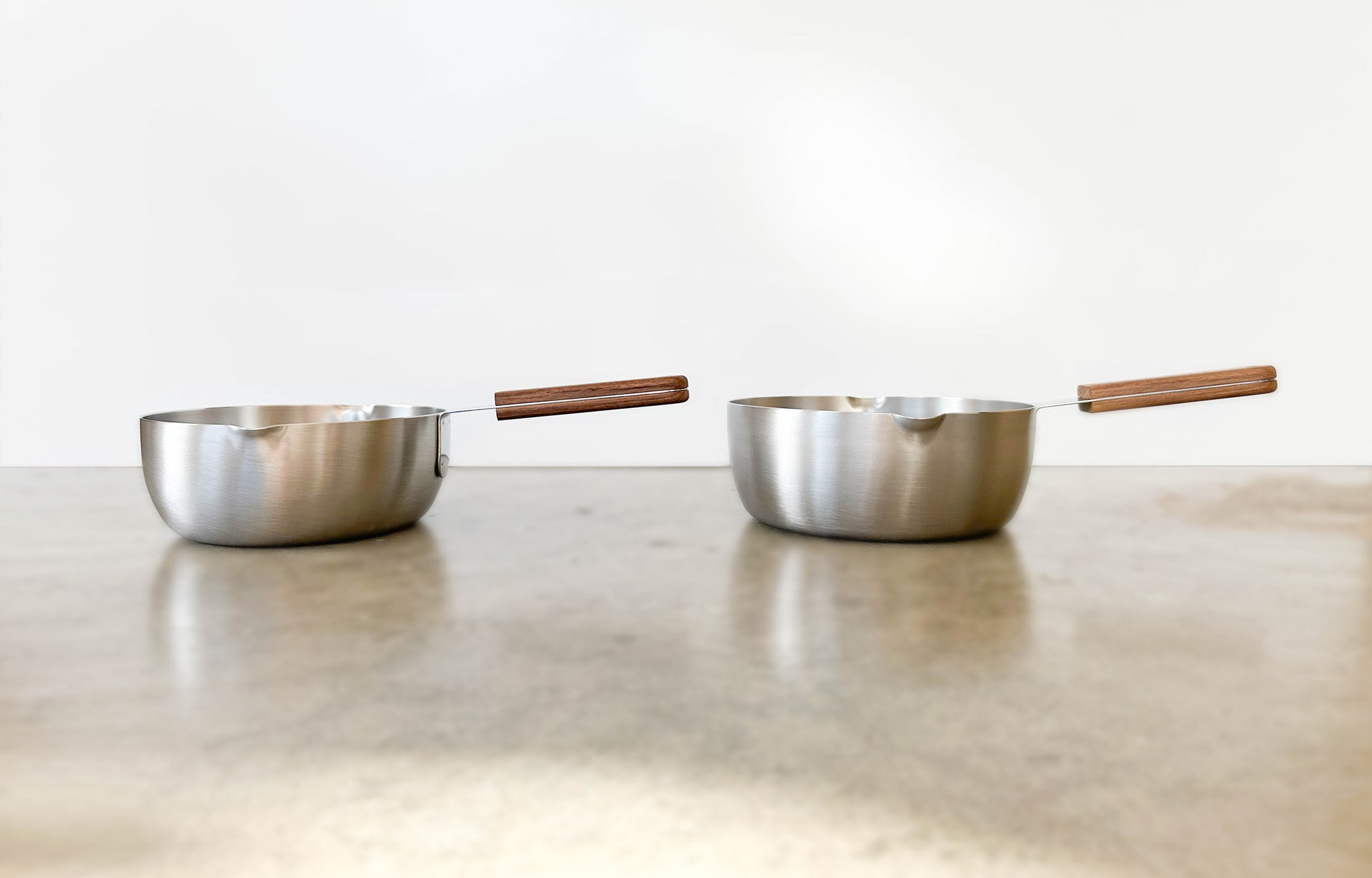 Stainless Steel Pot with Wood Handle shown in both sizes | lifestyle