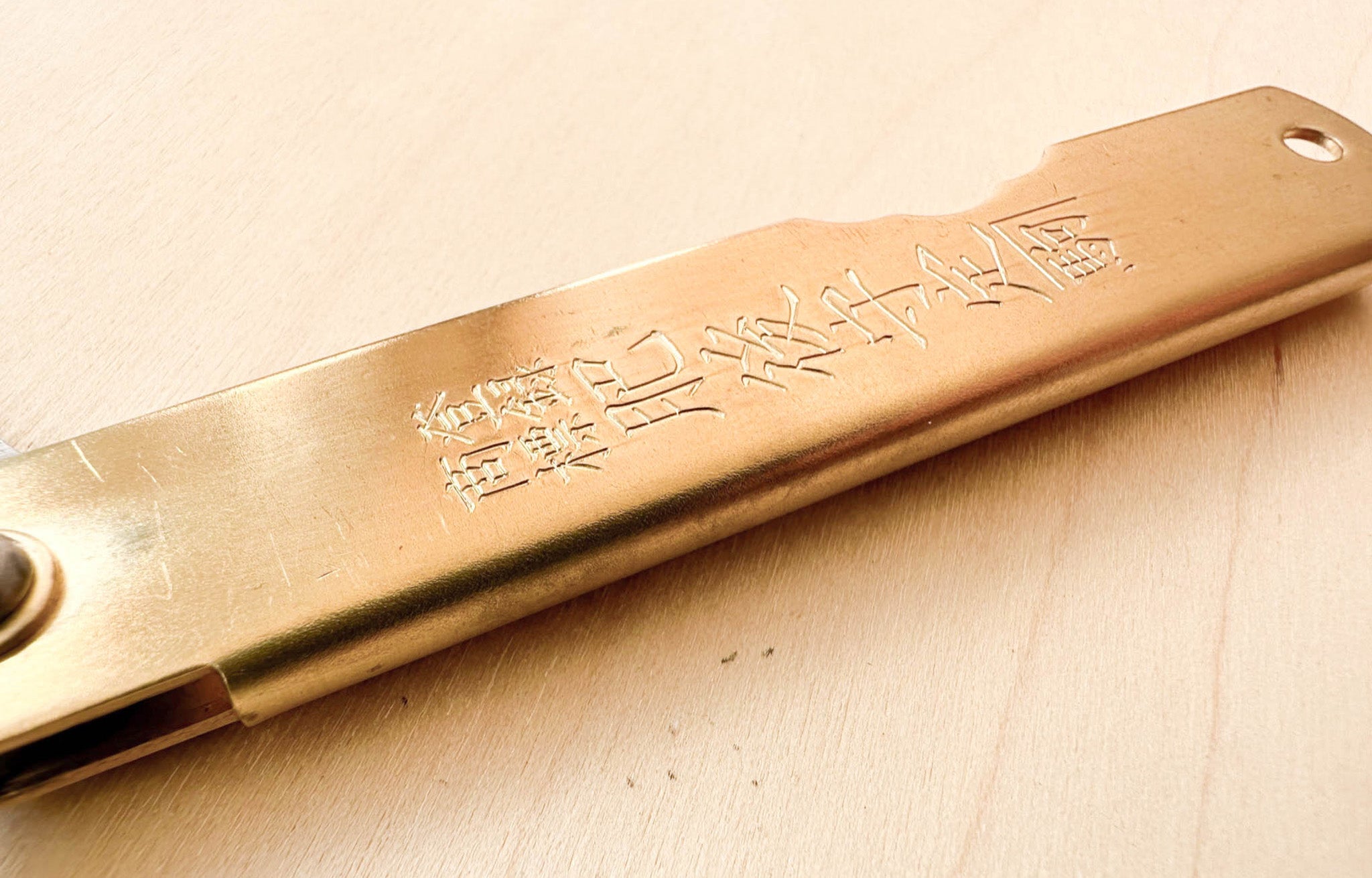 Close up of Japanese Folding Knife in Brass | lifestyle